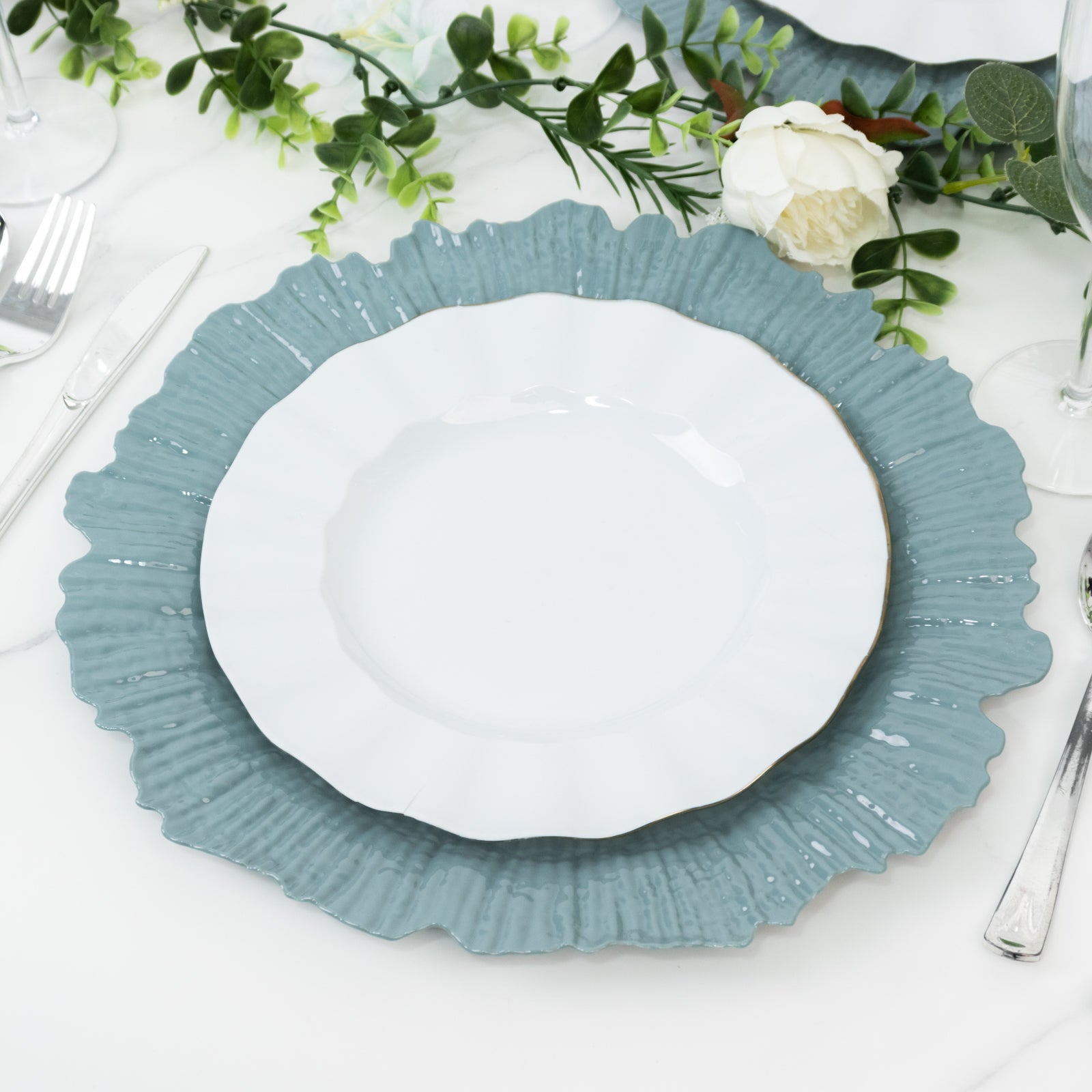 Dusty blue plastic charger plate for weddings and parties.