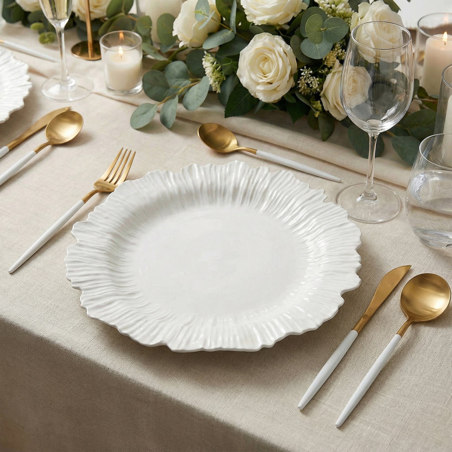 Pearl white charger plate set on a beautifully arranged dining table.