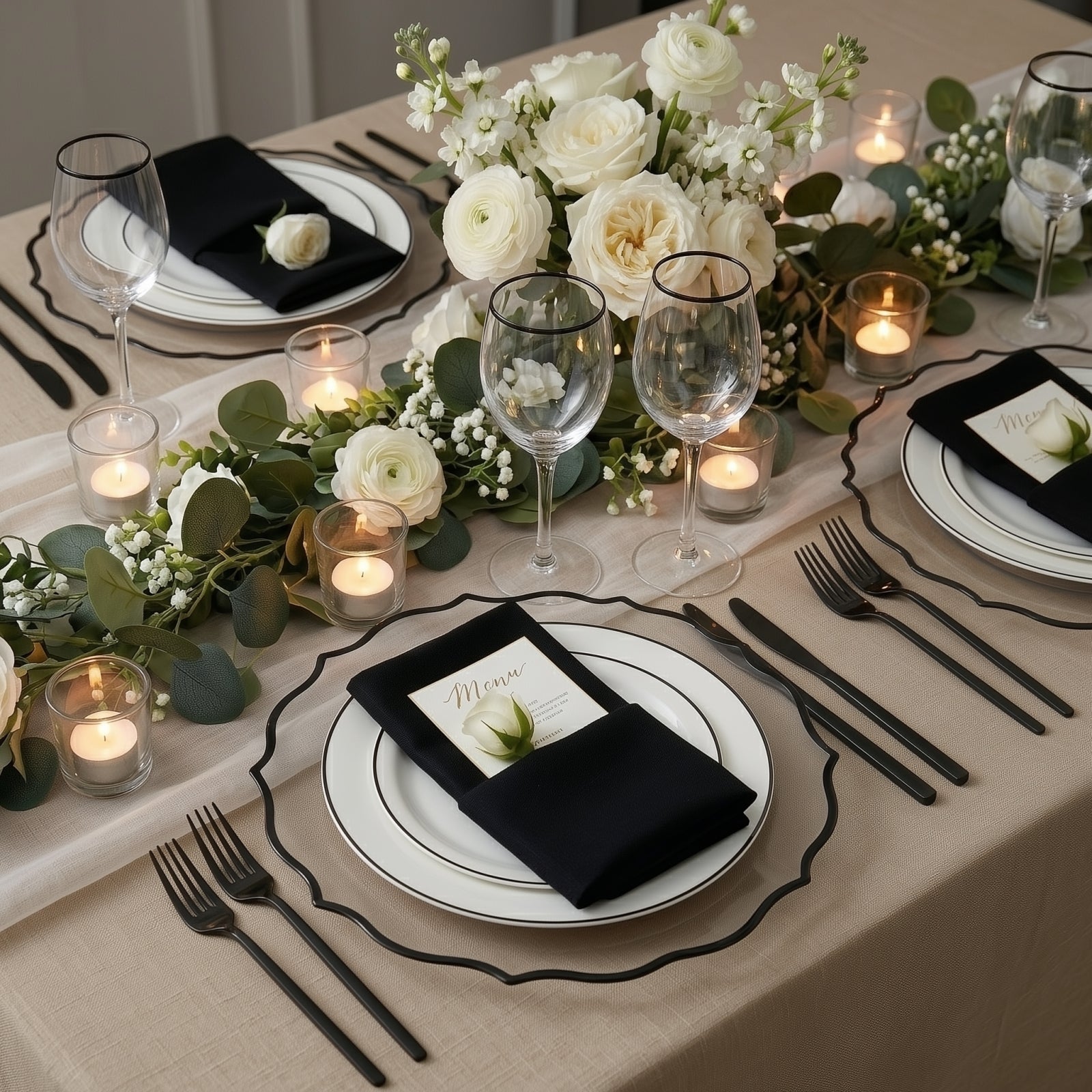 Clear charger plates with black scalloped rim on an elegant dinner table setting.