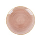 Transparent dusty rose swirl charger plate with gold rim.