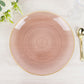Transparent dusty rose swirl charger plate with gold rim.