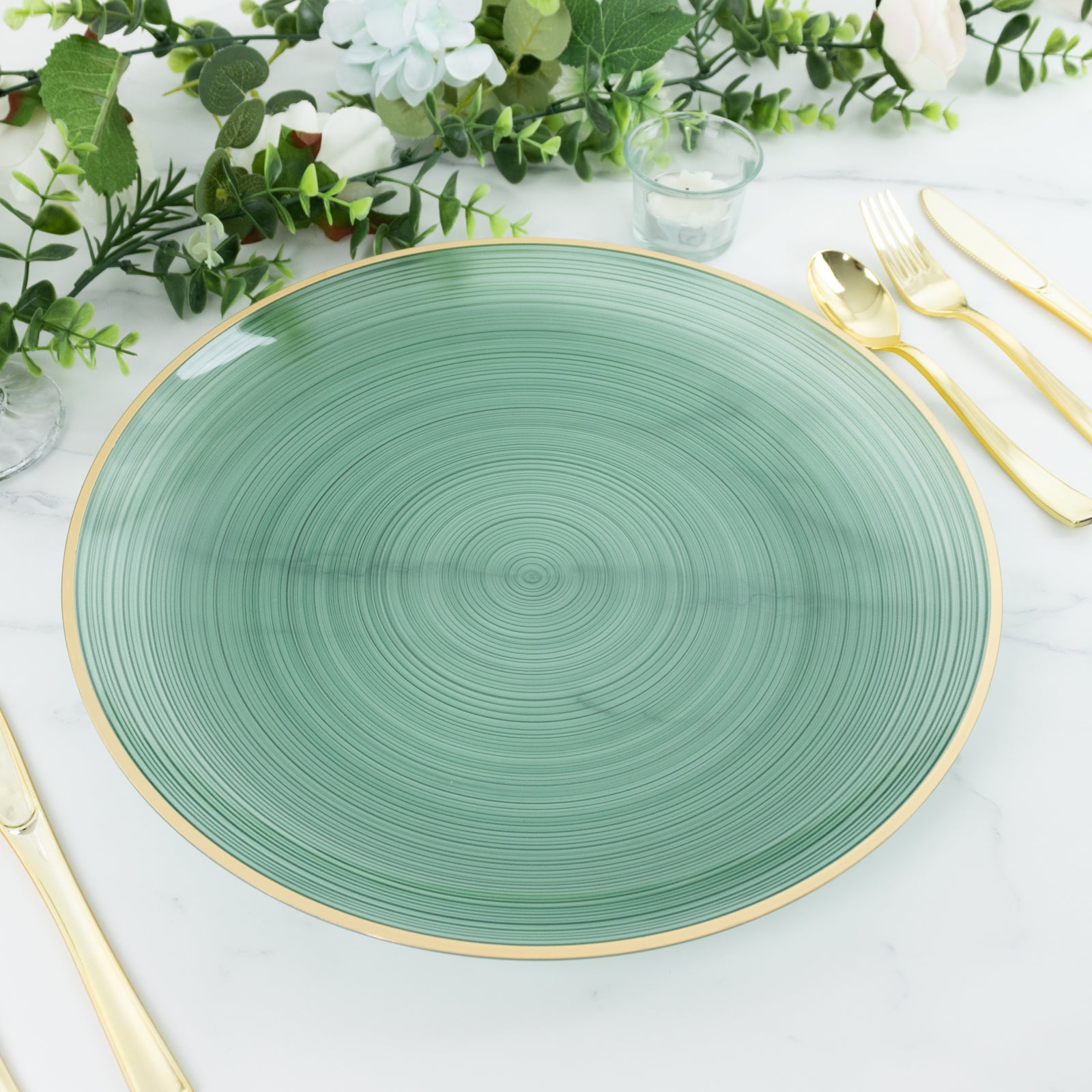 Transparent dusty sage green swirl charger plate with gold rim.
