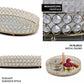 Gold metal round mirror vanity tray with decorative crystals.