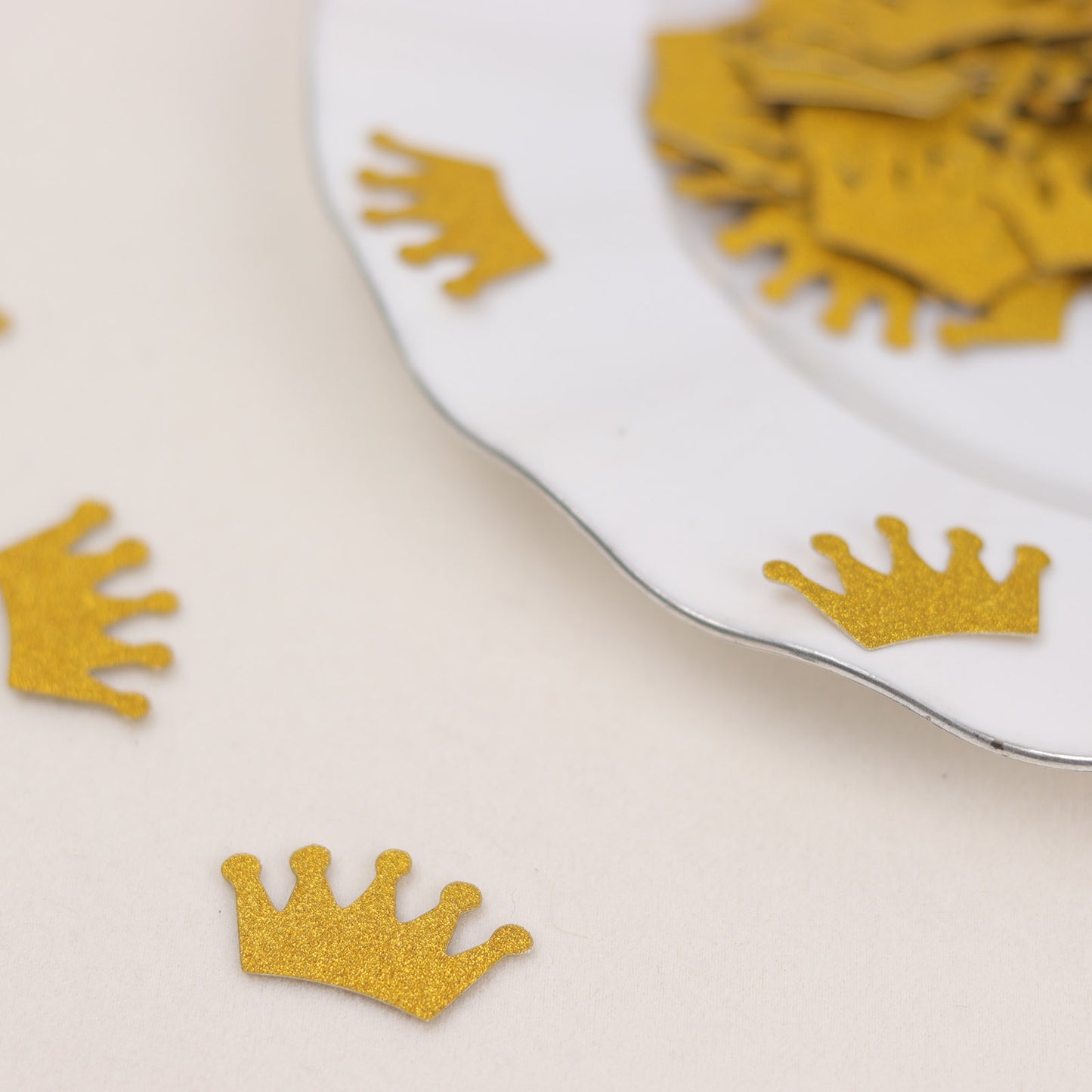 Gold glitter crown confetti for princess theme party decoration.
