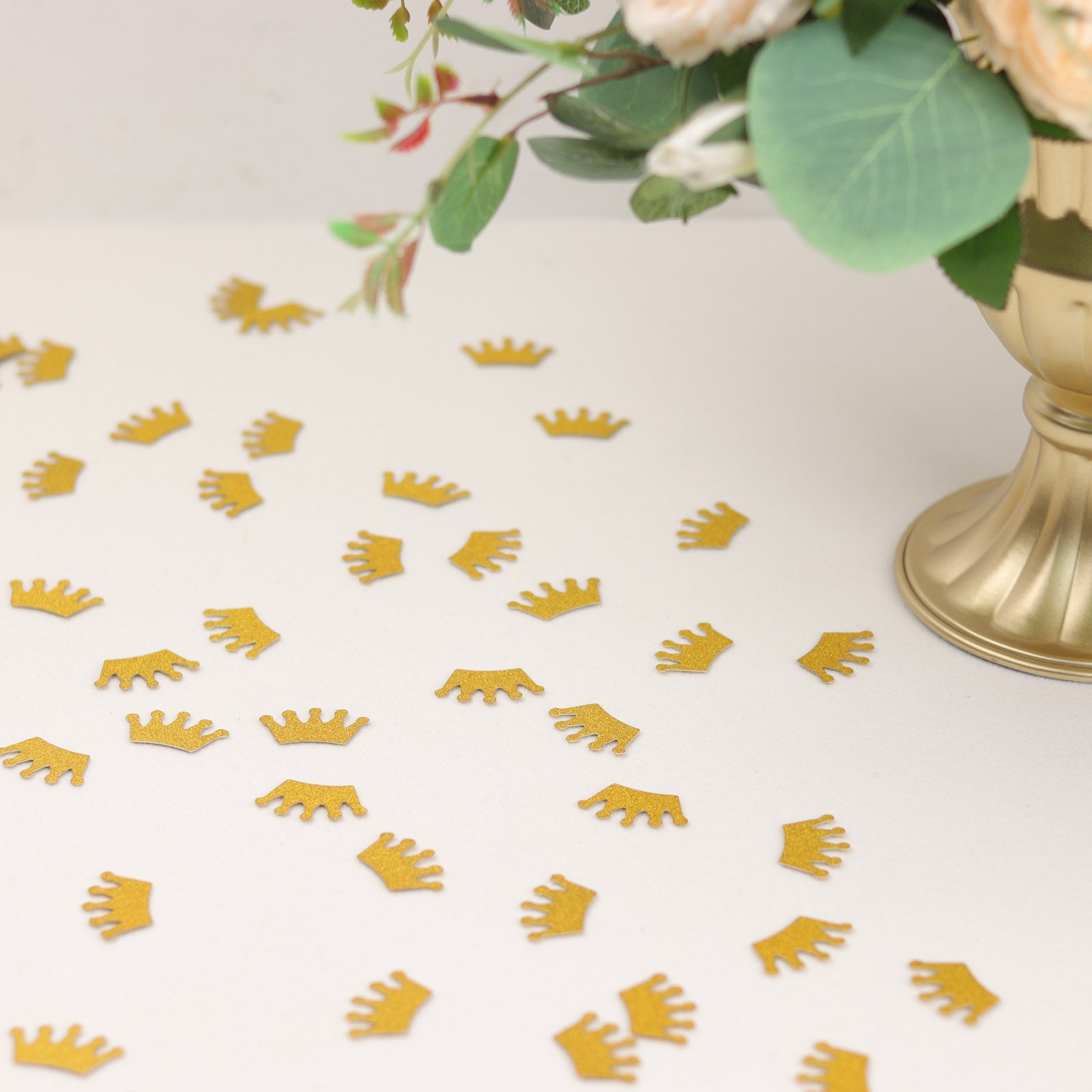 Gold glitter crown paper confetti scatters for princess theme party decoration.