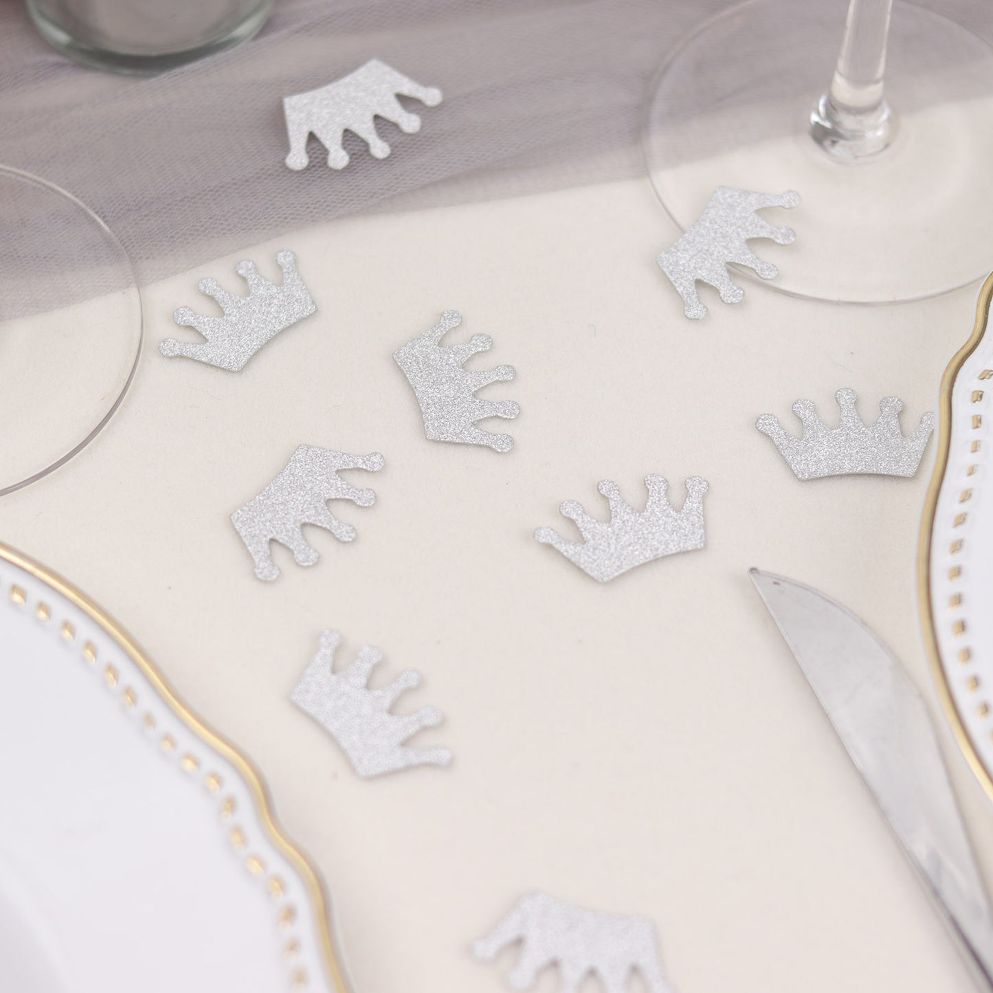 Silver glitter crown confetti for princess theme party table decoration.