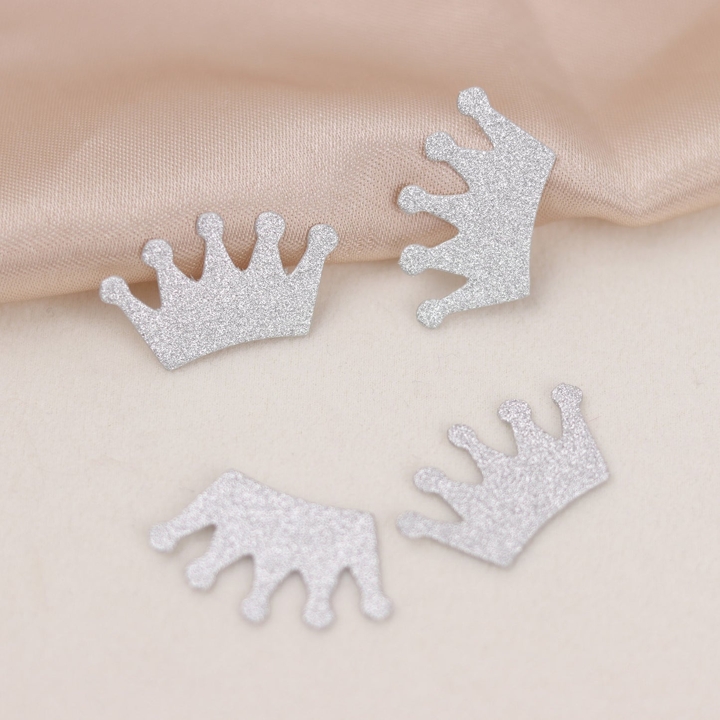 Silver glitter crown paper confetti for princess-themed party decoration.