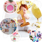 Purple and gold confetti mix with balloons and party decorations.