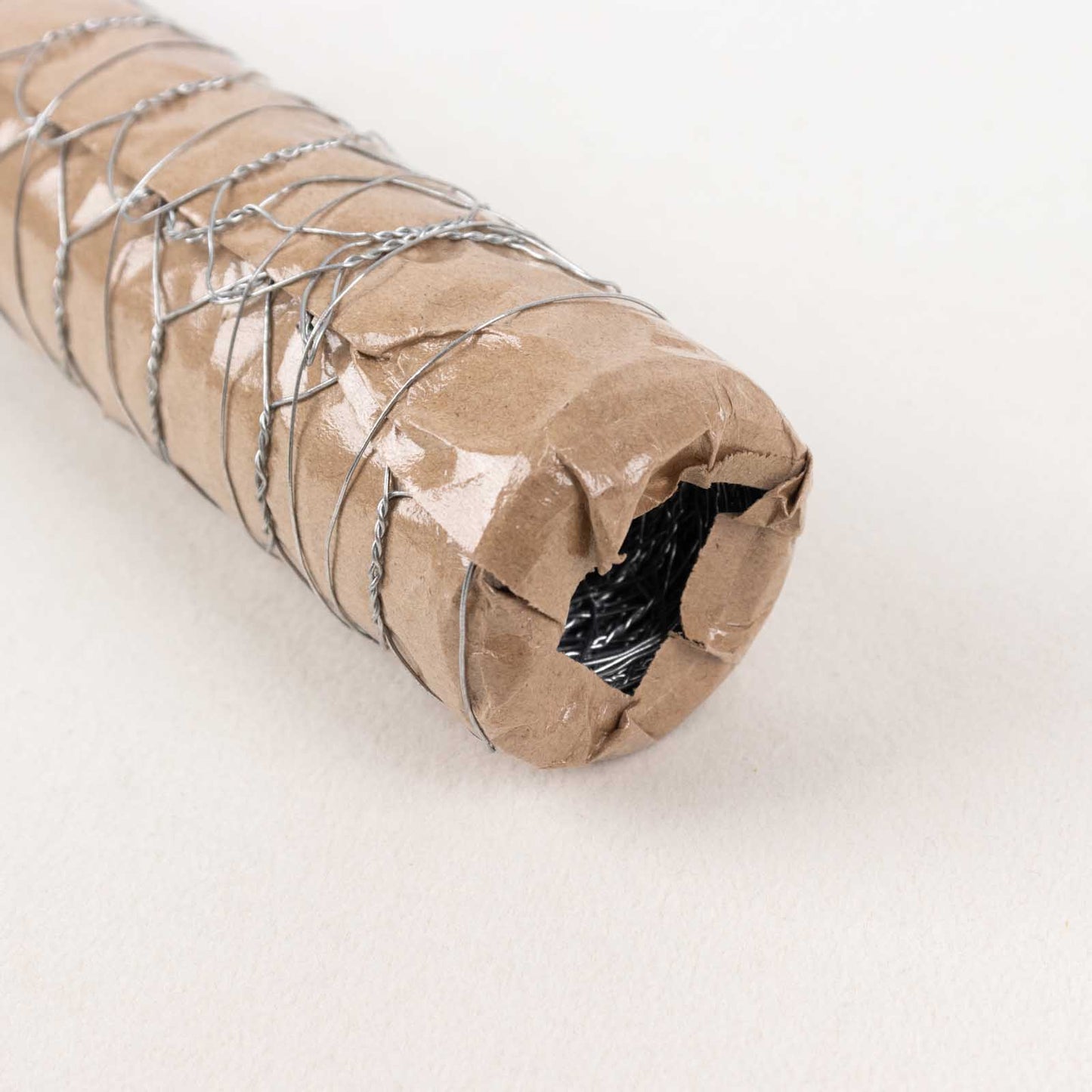 Silver galvanized metal hexagonal chicken wire mesh roll for DIY crafts and garden fencing.