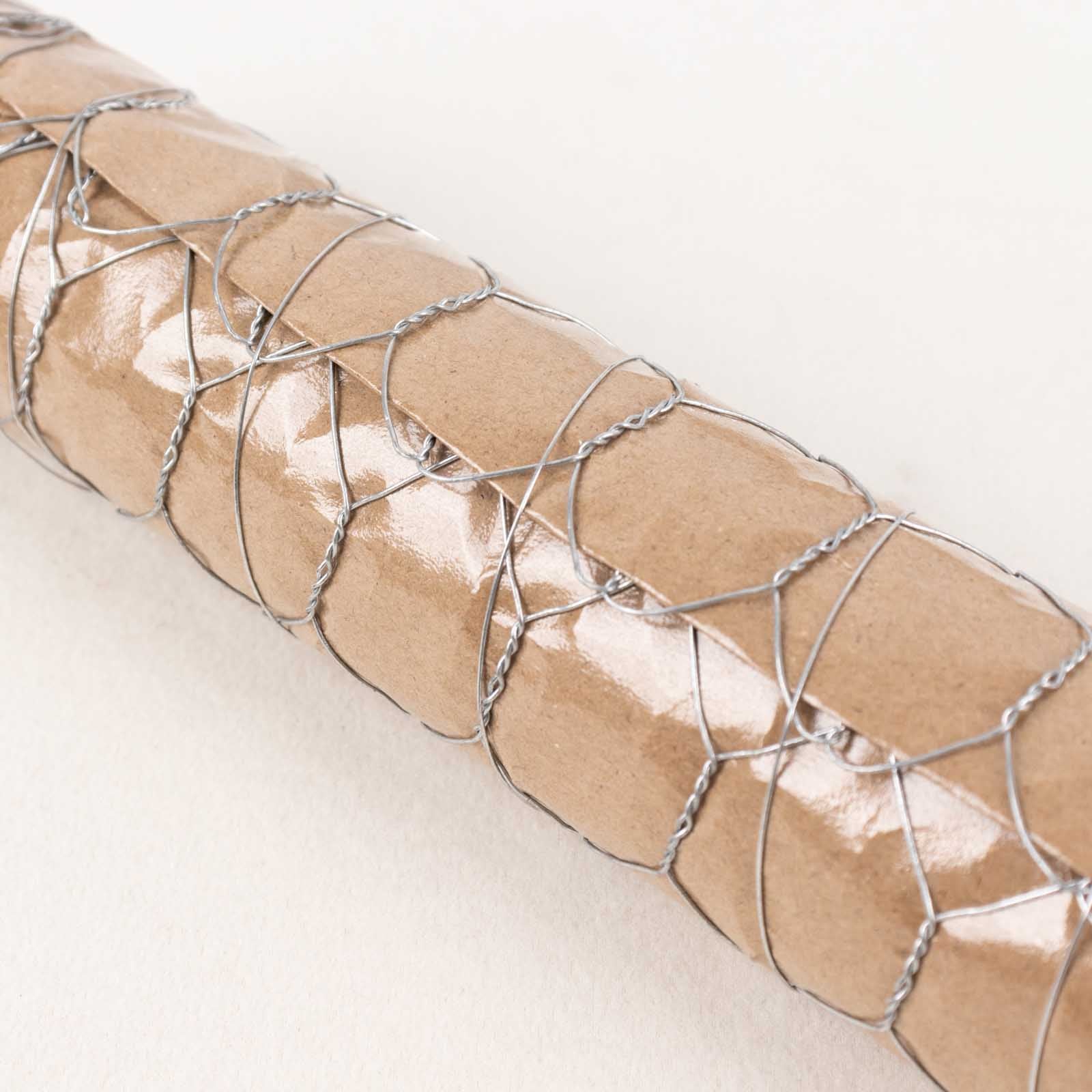 Silver galvanized metal hexagonal chicken wire mesh for crafts and fencing.