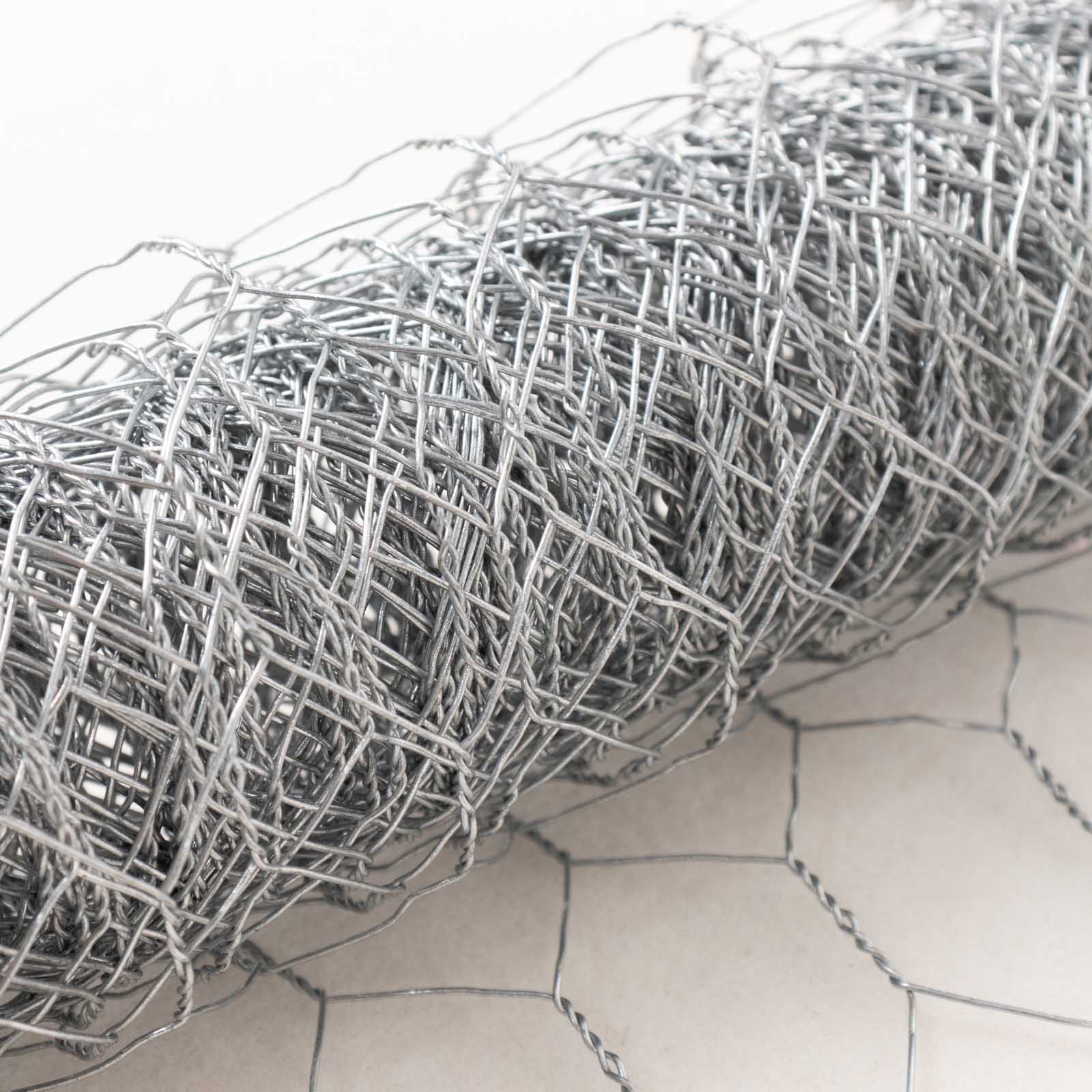 Silver galvanized hexagonal chicken wire mesh for crafts and garden fencing.