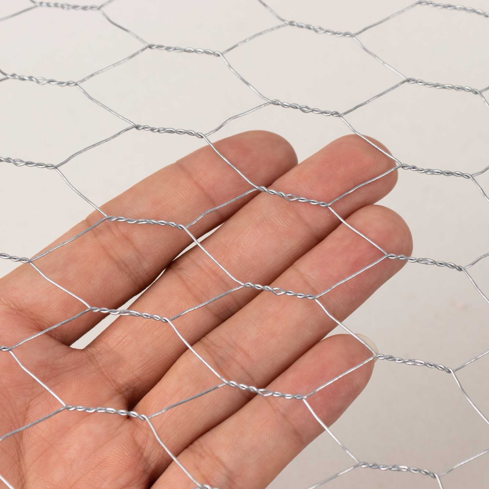 Silver galvanized metal hexagonal chicken wire mesh for DIY crafts and garden fencing.