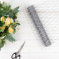 Silver galvanized metal hexagonal chicken wire mesh for DIY crafts and garden fencing.