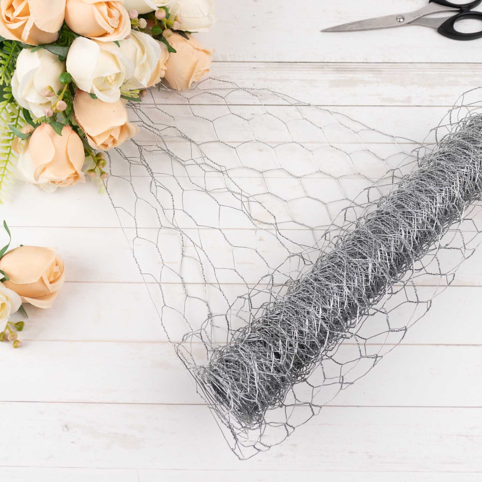 Silver galvanized metal hexagonal chicken wire mesh for DIY crafts and garden fencing.