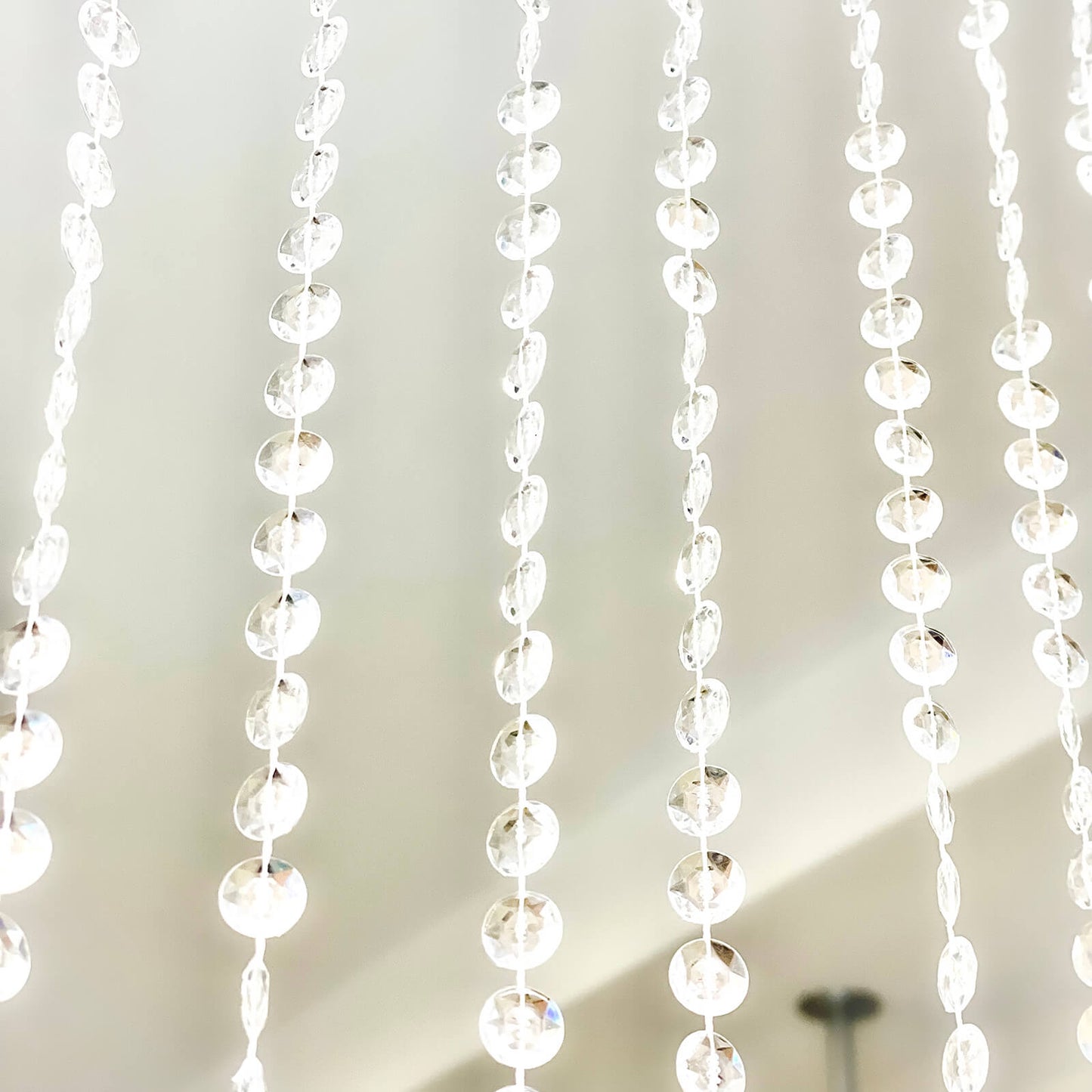 Clear acrylic crystal beaded curtain strands for room divider.