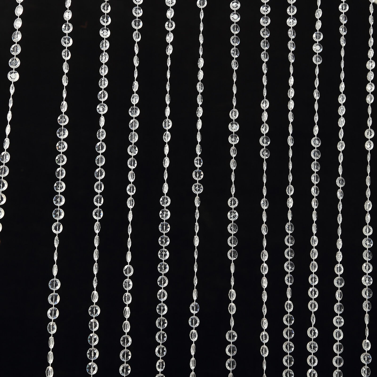 Clear acrylic crystal beaded curtain with diamond cut beads.