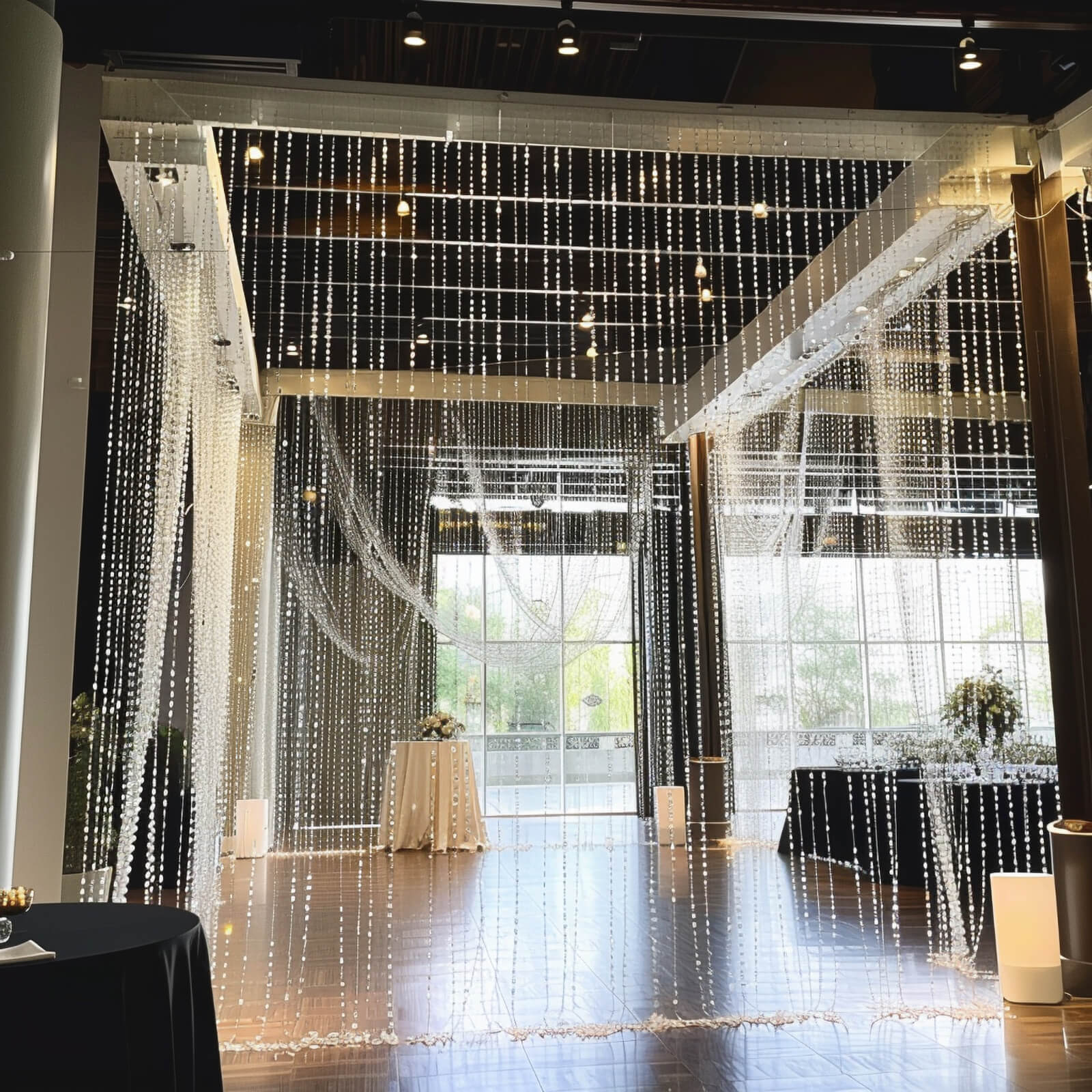 Clear acrylic beaded curtain room divider with fabric rod pocket.