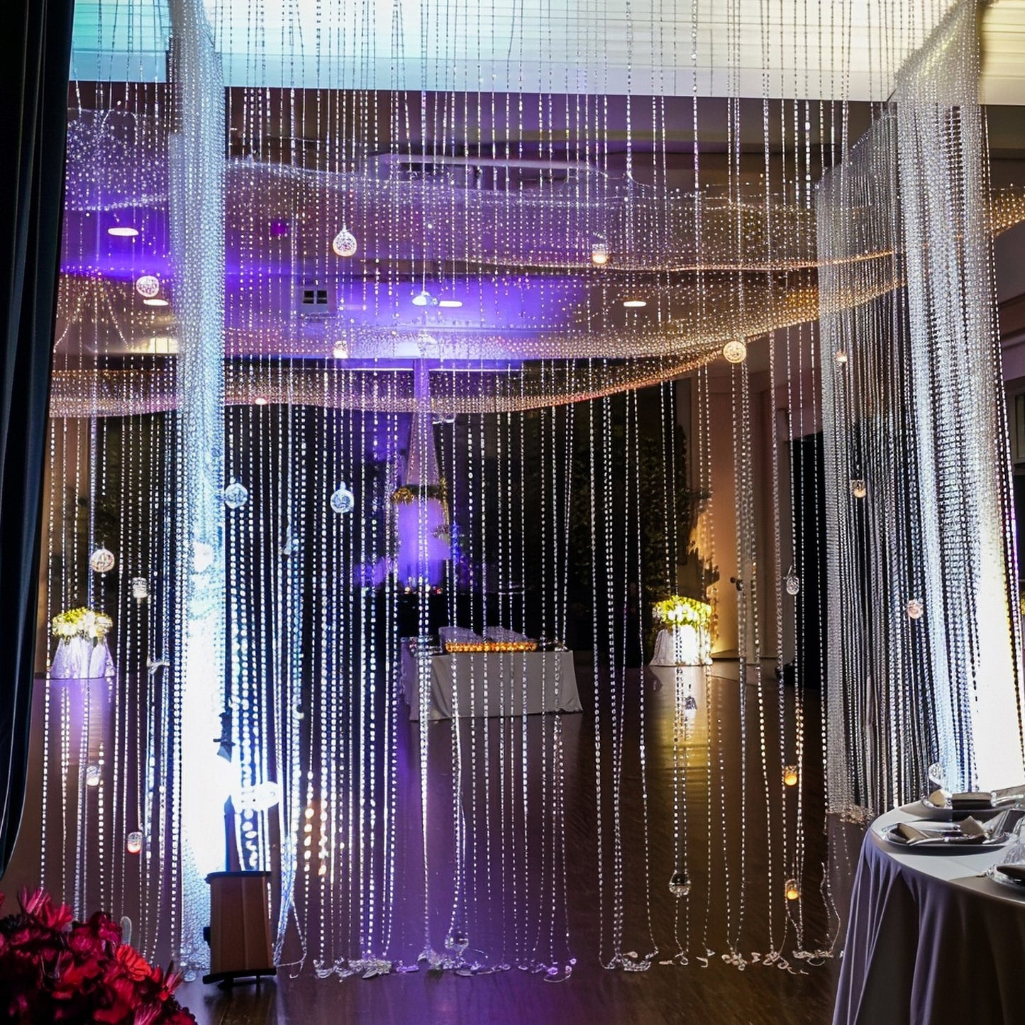 Clear acrylic beaded curtain room divider with diamond cut beads.