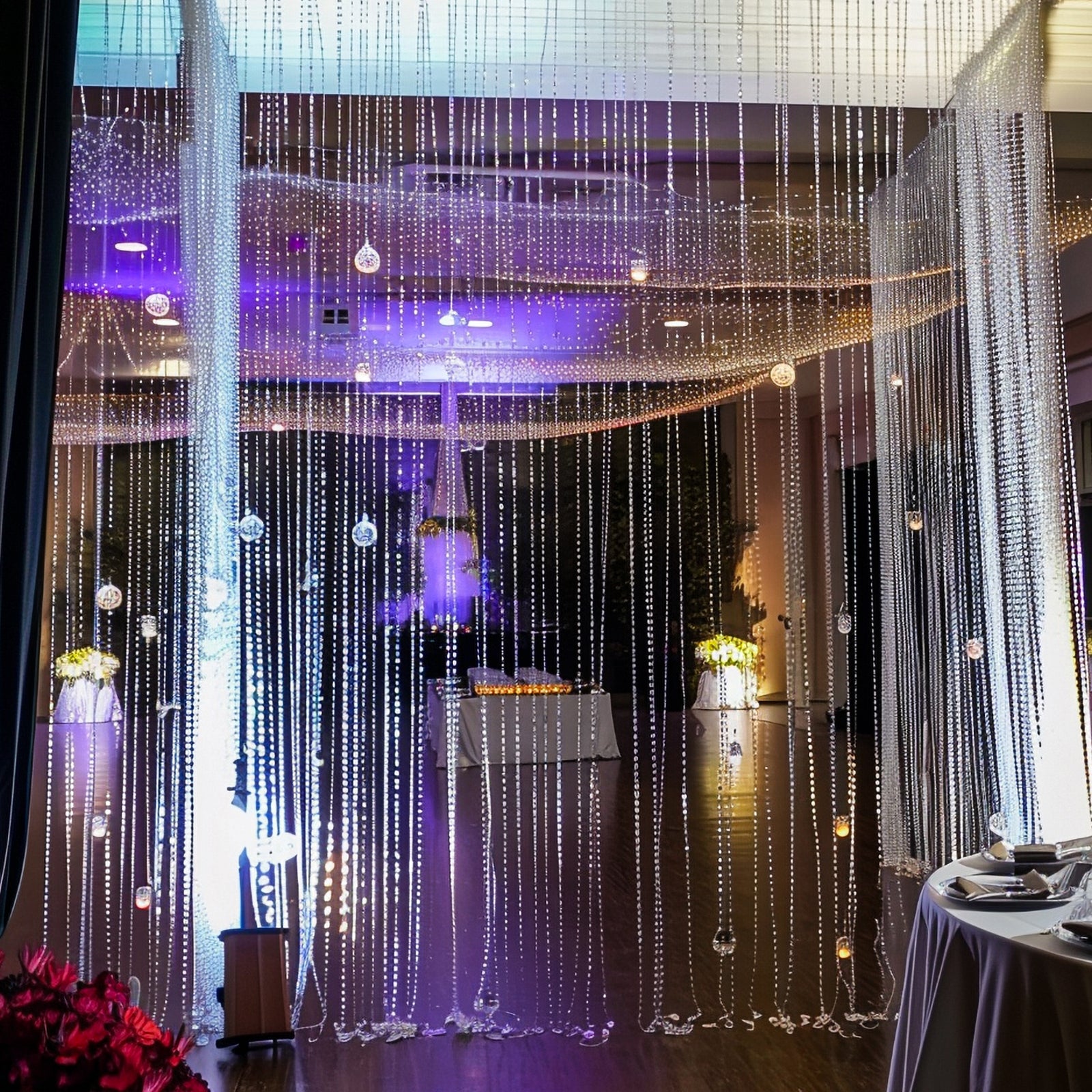 Clear acrylic beaded curtain room divider with diamond cut beads.