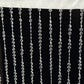 Clear acrylic crystal beaded curtain with fabric rod pocket.