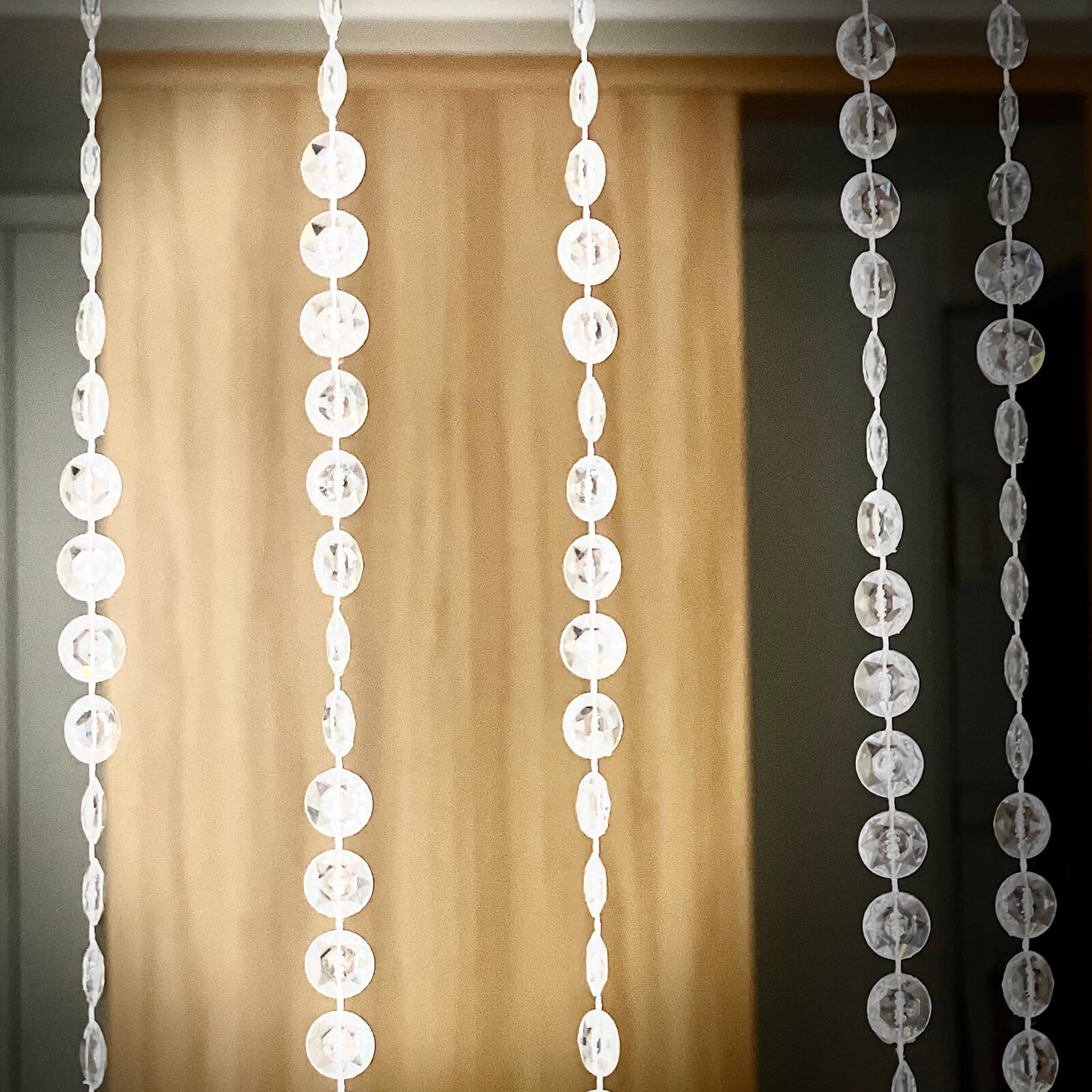Clear acrylic beaded curtain with fabric rod pocket, 5ftx16ft.