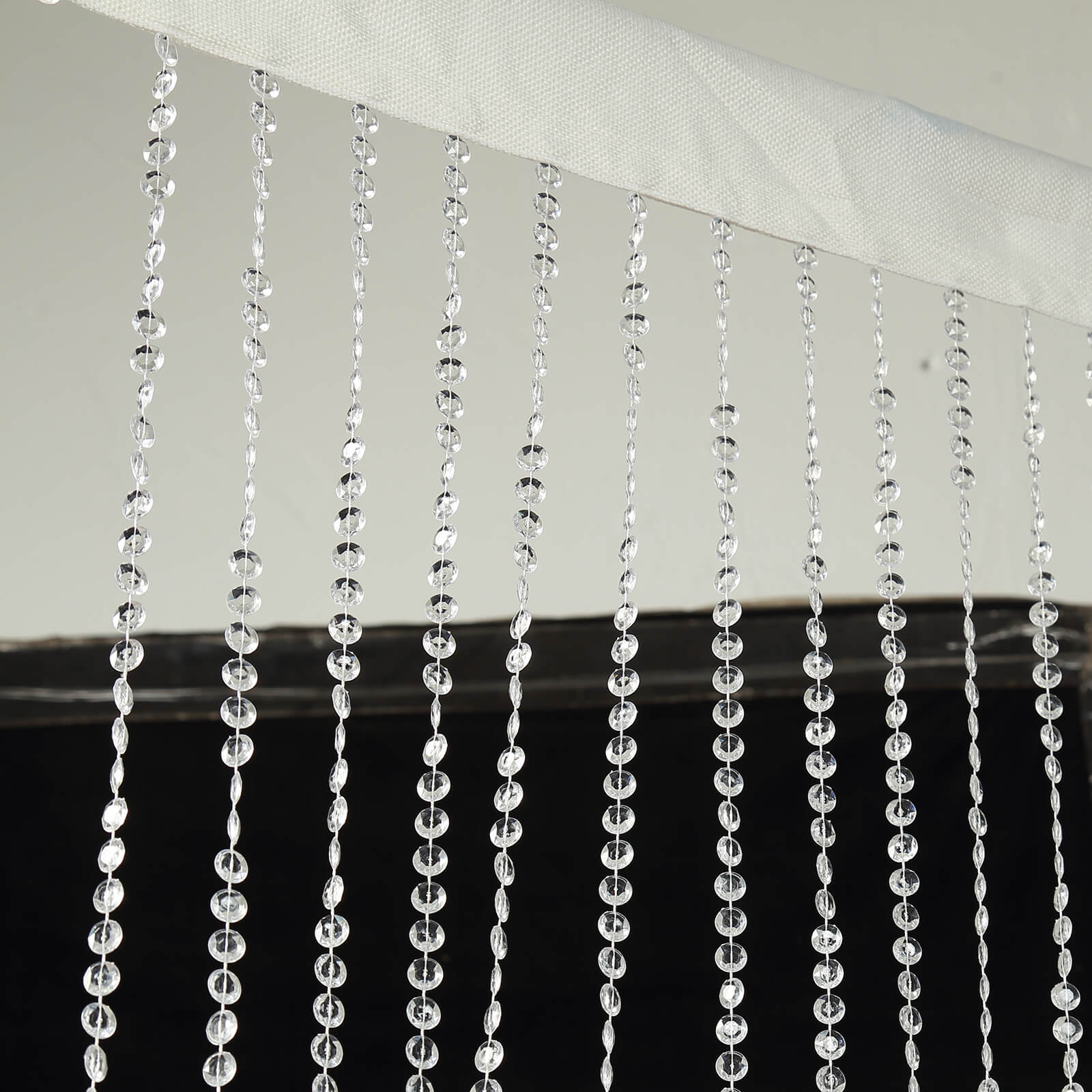 Clear acrylic beaded curtain with fabric rod pocket, 5ftx16ft.