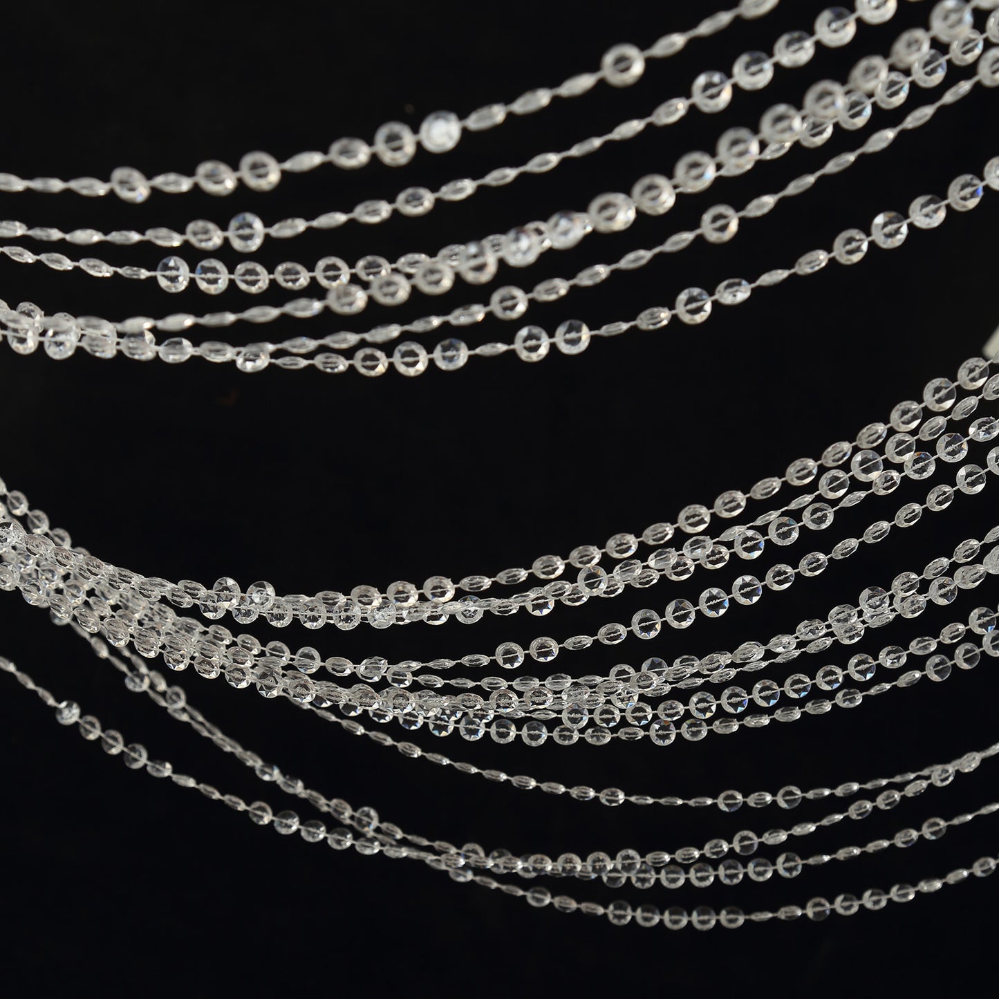 Clear acrylic crystal beaded curtain strands for room divider or doorway.