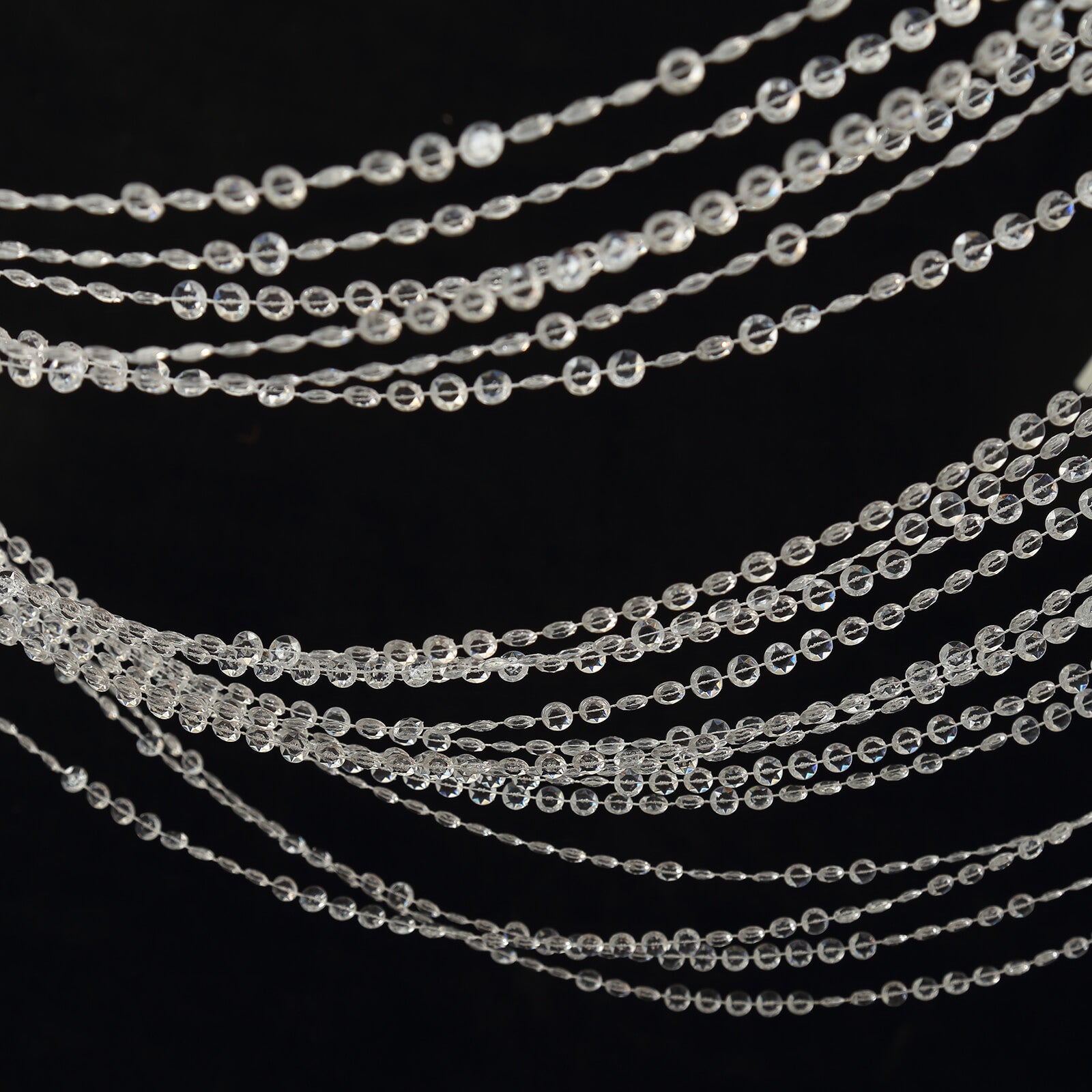 Clear acrylic crystal beaded curtain strands for room divider or doorway.