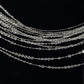 Clear acrylic beaded curtain with diamond cut beads and fabric rod pocket.