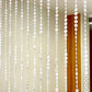 Clear acrylic beaded curtain room divider with diamond cut beads.