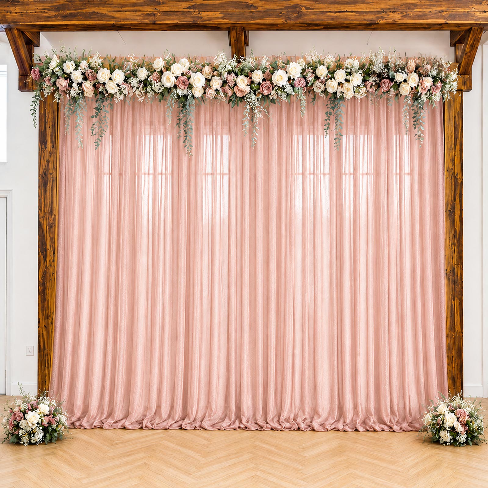 Blush sheer backdrop drape for wedding arch and ceiling decor.