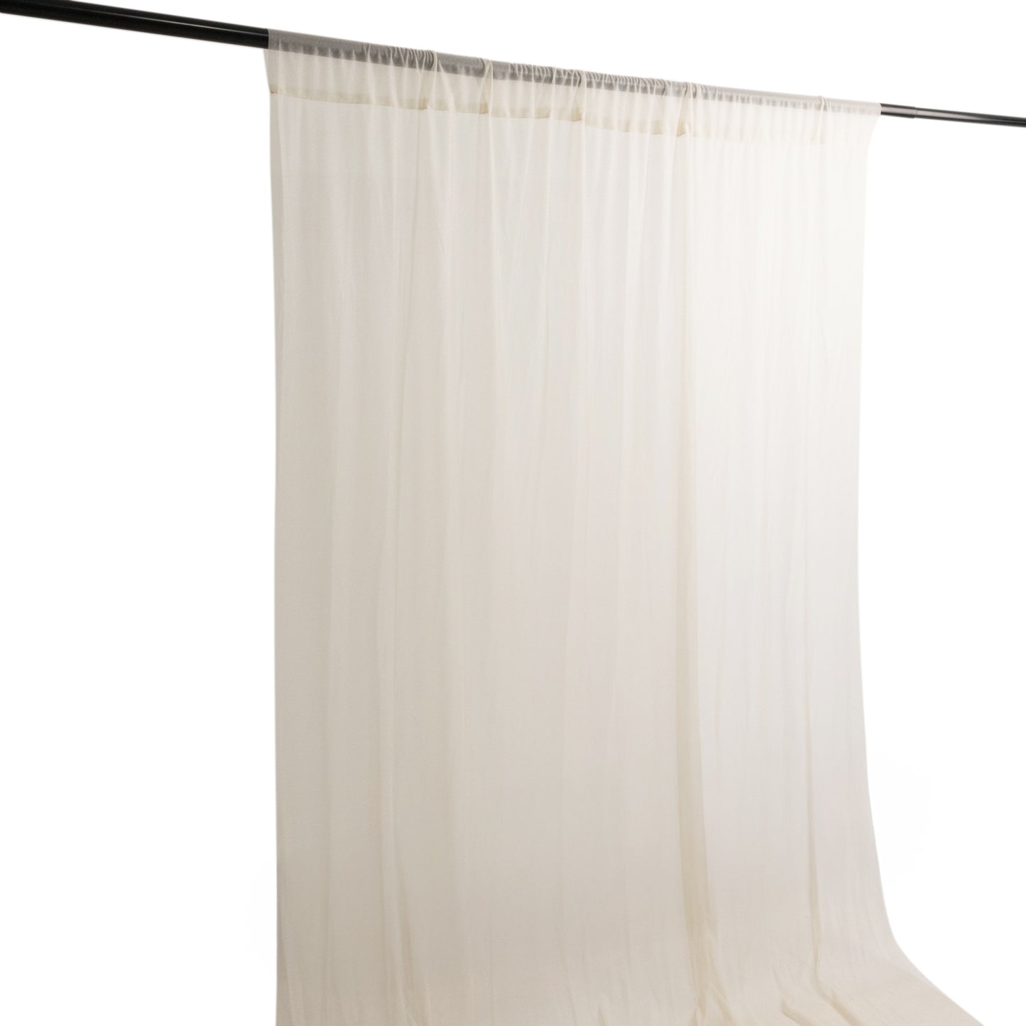 Beige sheer backdrop drape for wedding arch and ceiling decor.
