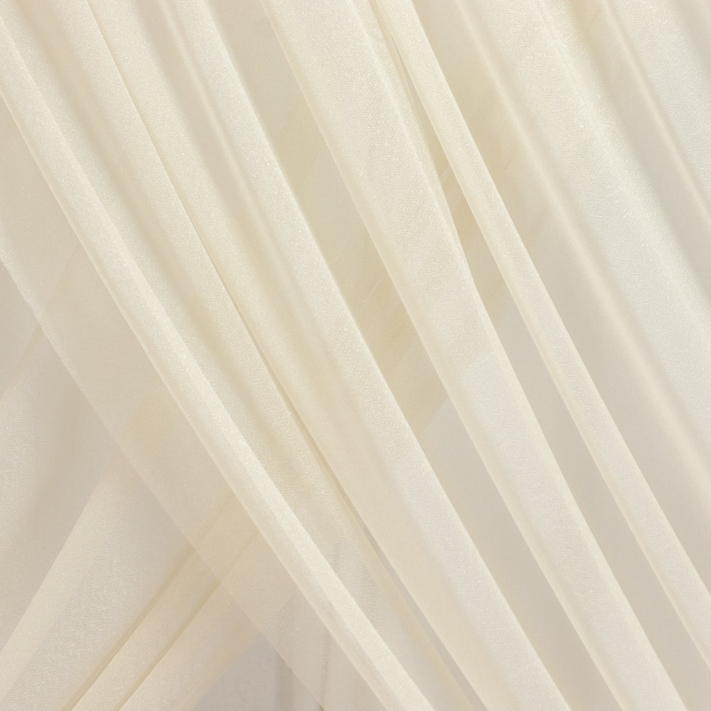 Beige sheer backdrop drape panel for wedding arch and ceiling decor.