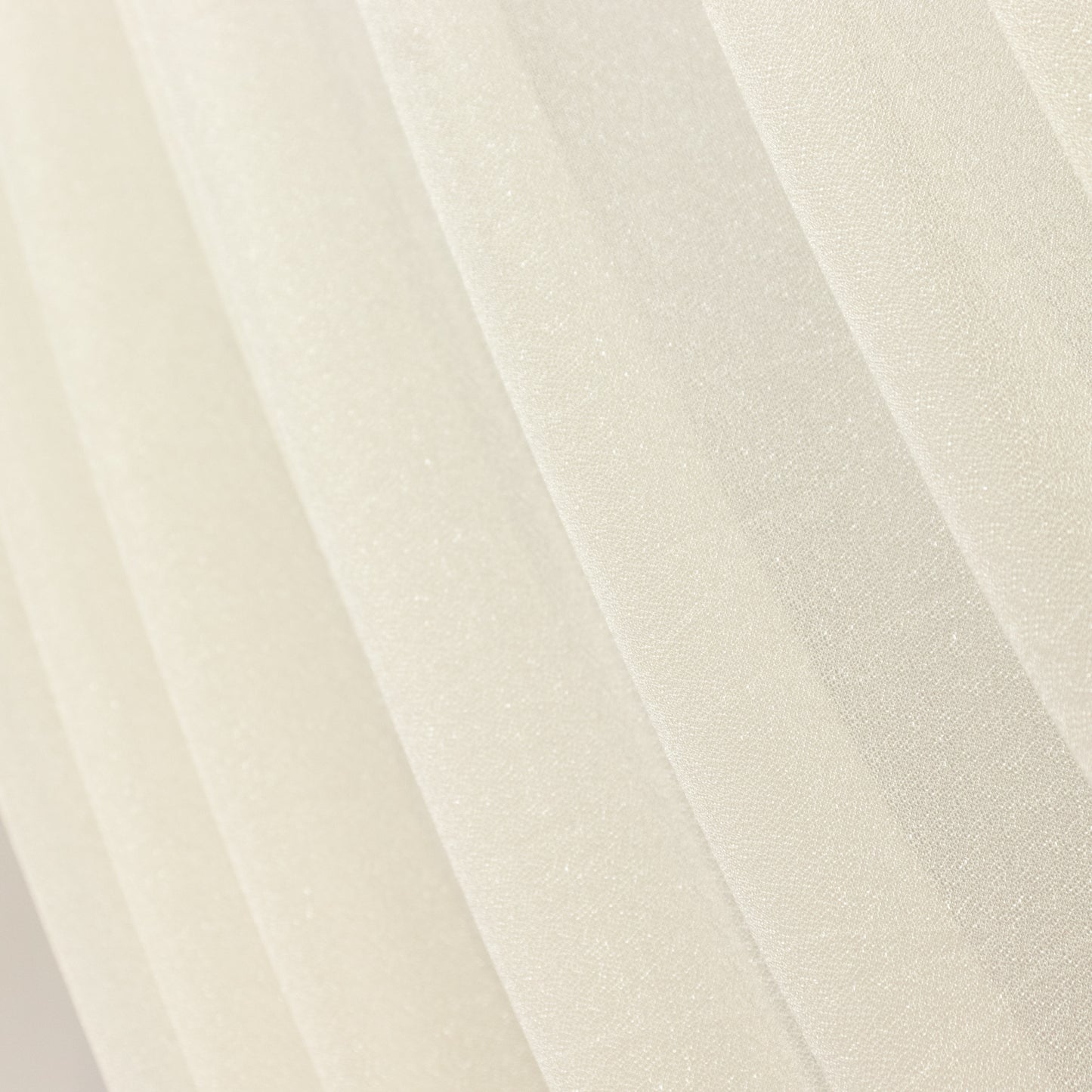 Beige sheer backdrop drape with soft shimmer for wedding decor.