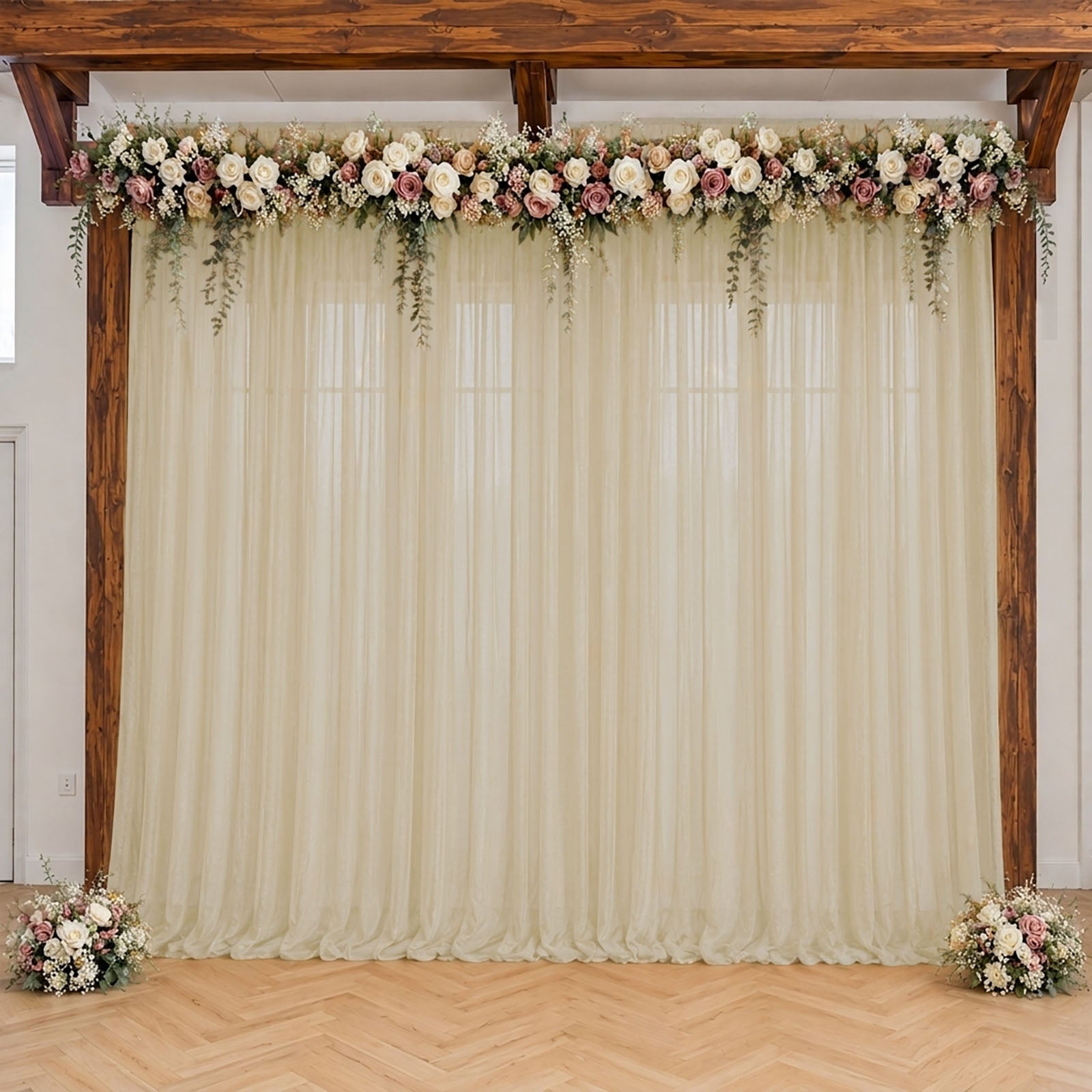 Beige sheer backdrop drape for wedding arch and ceiling decor.