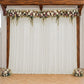 Ivory sheer backdrop drape for wedding arch and ceiling decor.