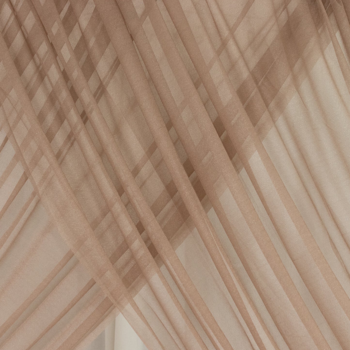 Taupe sheer backdrop drape for wedding arch and ceiling decor.