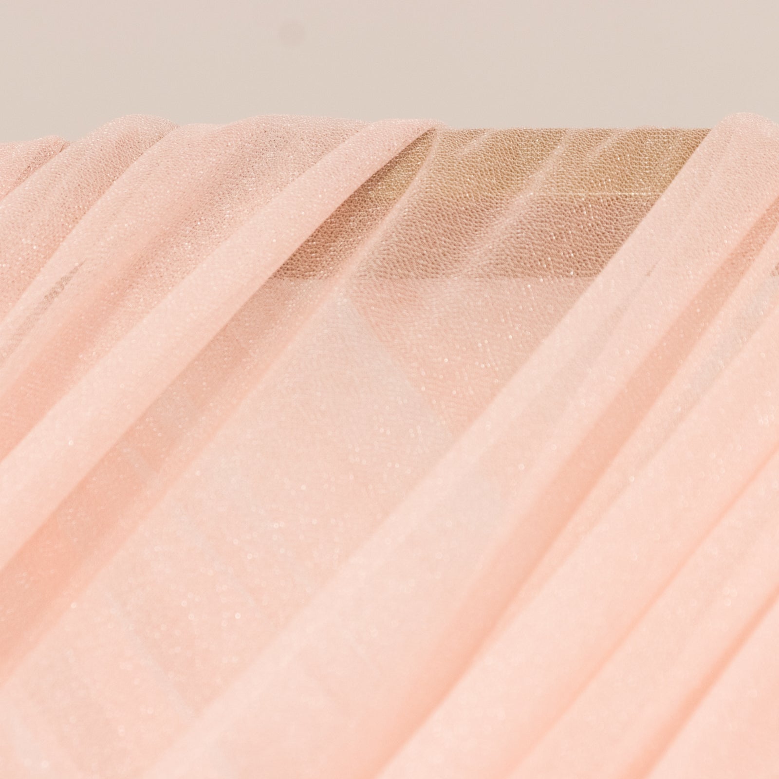 Blush sheer backdrop drape for wedding arch and ceiling decor.