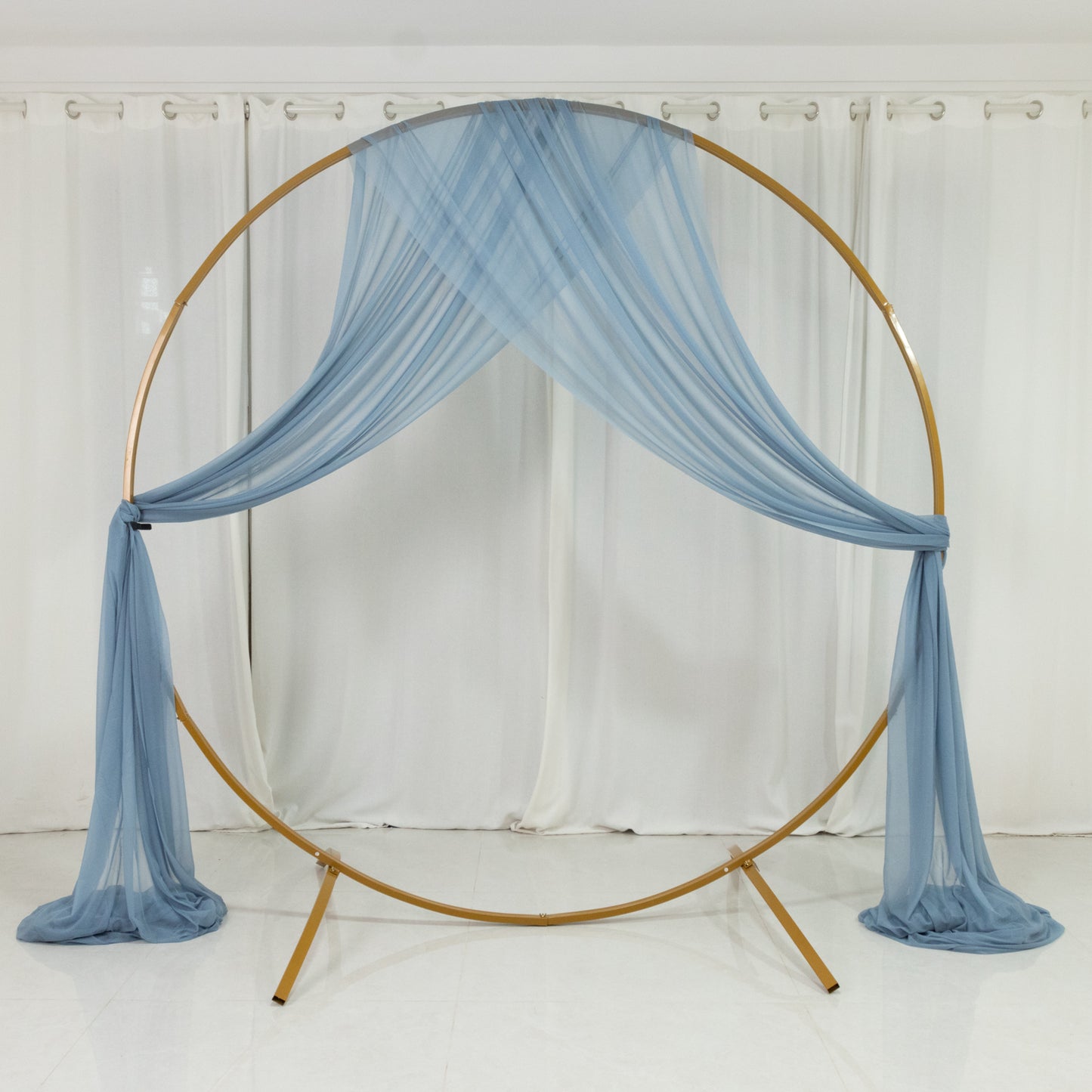Dusty blue sheer backdrop drape for wedding arch decor.