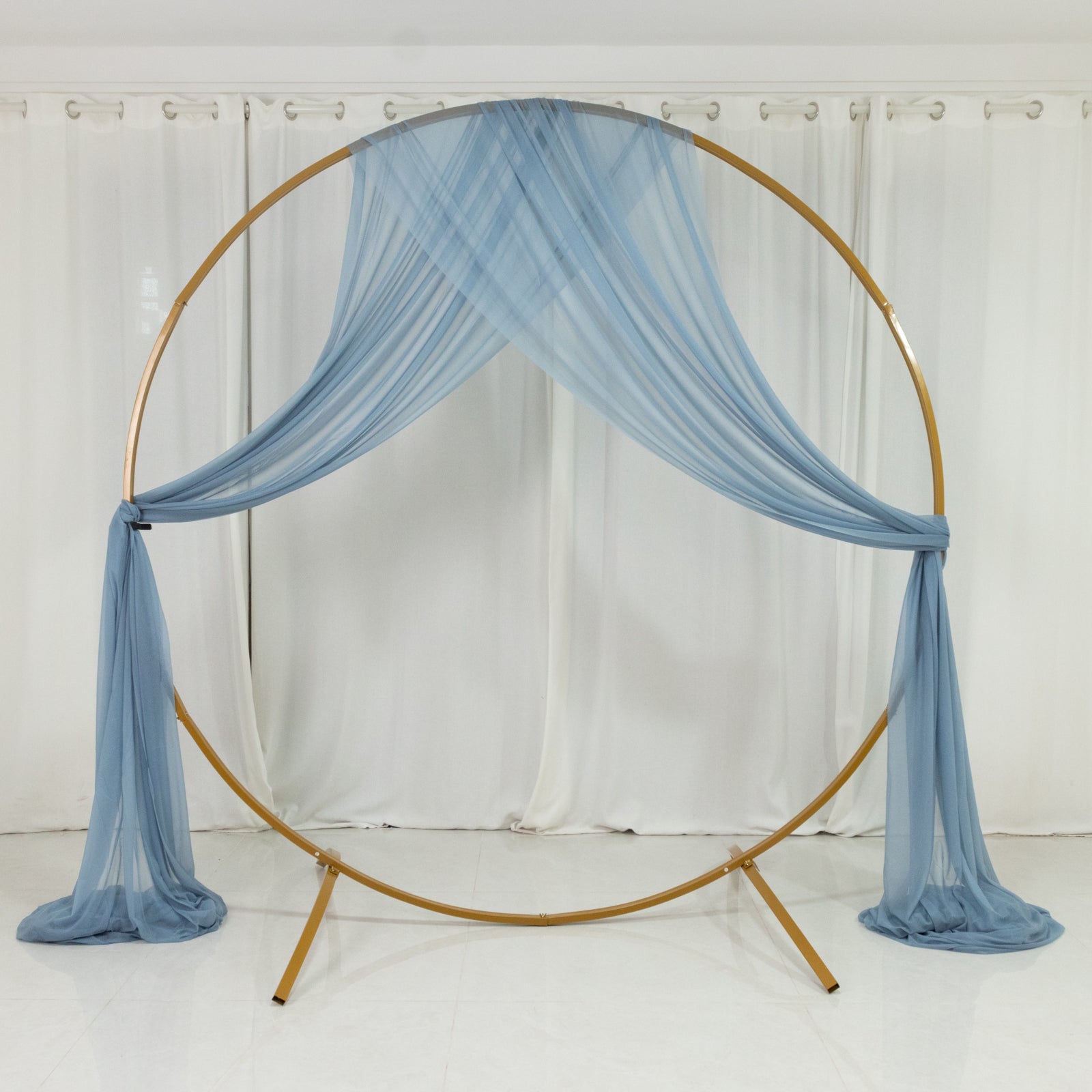Dusty blue sheer backdrop drape for wedding arch decor.