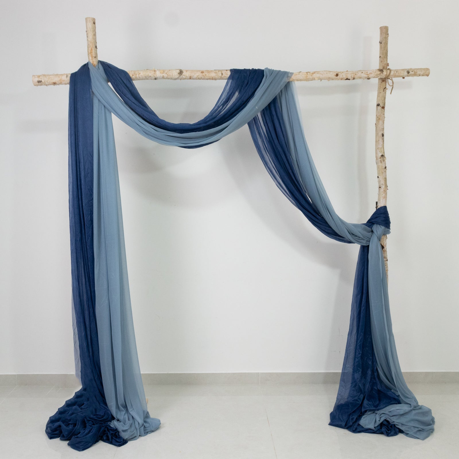 Dusty blue sheer backdrop drape for wedding arch and ceiling decor.