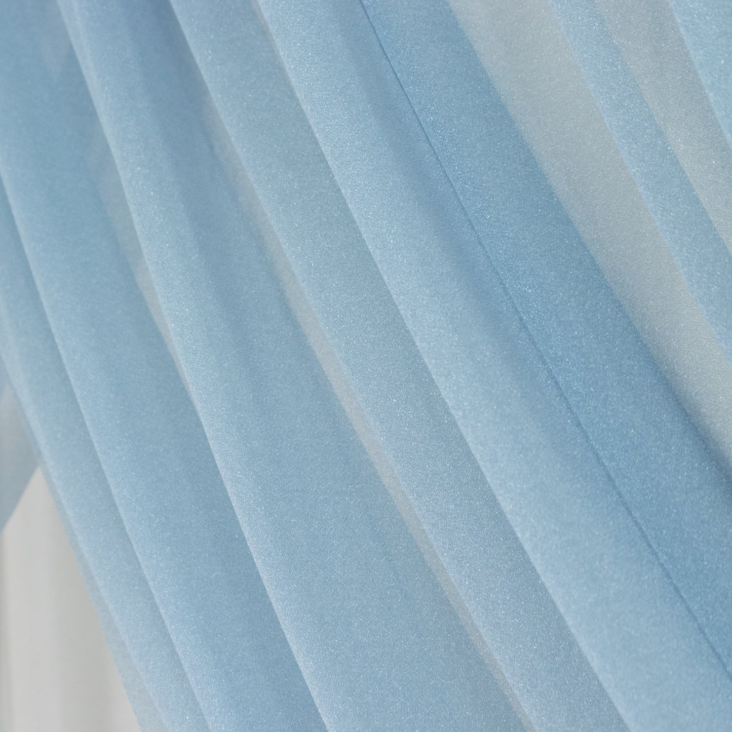Dusty blue sheer backdrop drape for wedding arch and ceiling decor.