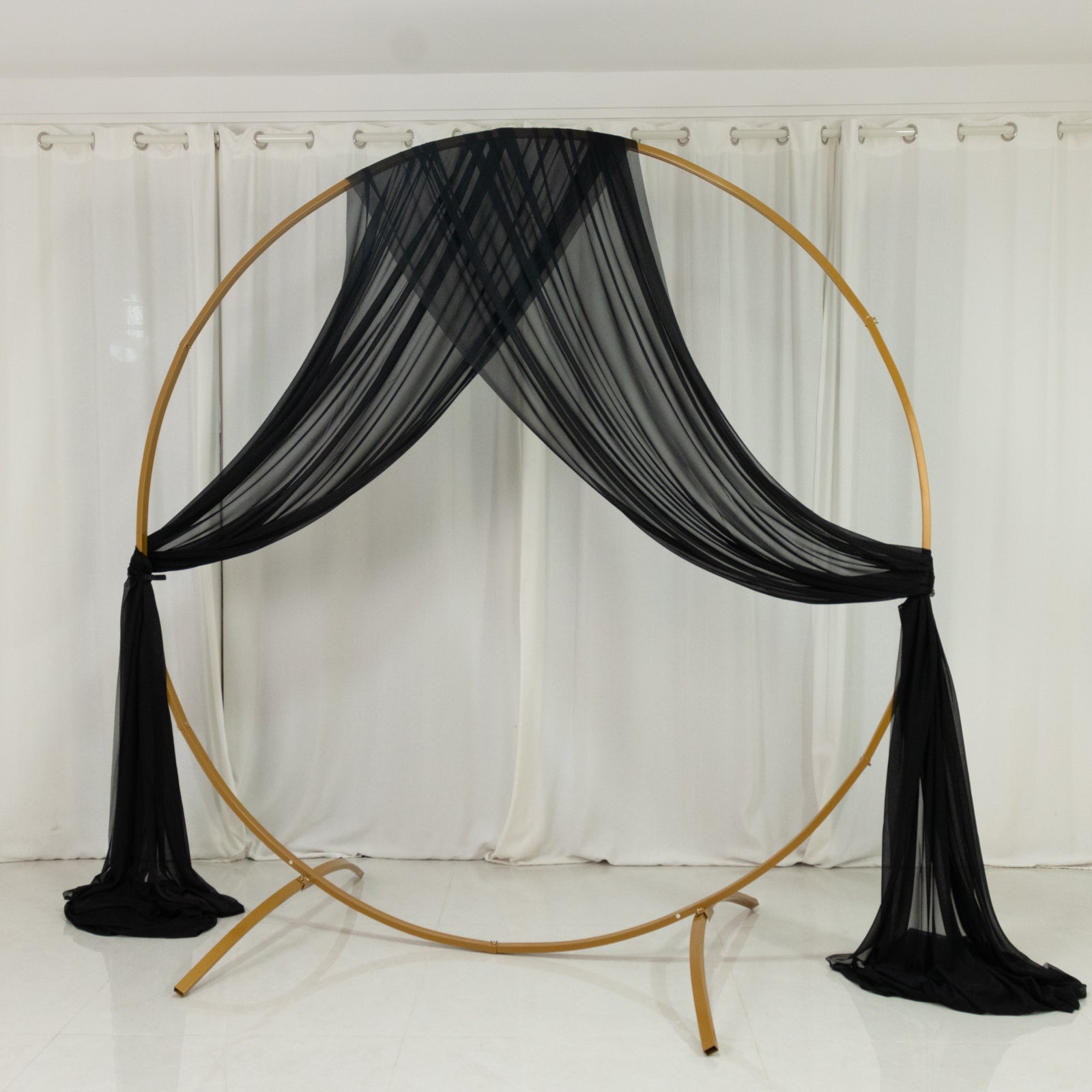 Black sheer backdrop drape for wedding arch and ceiling decor.
