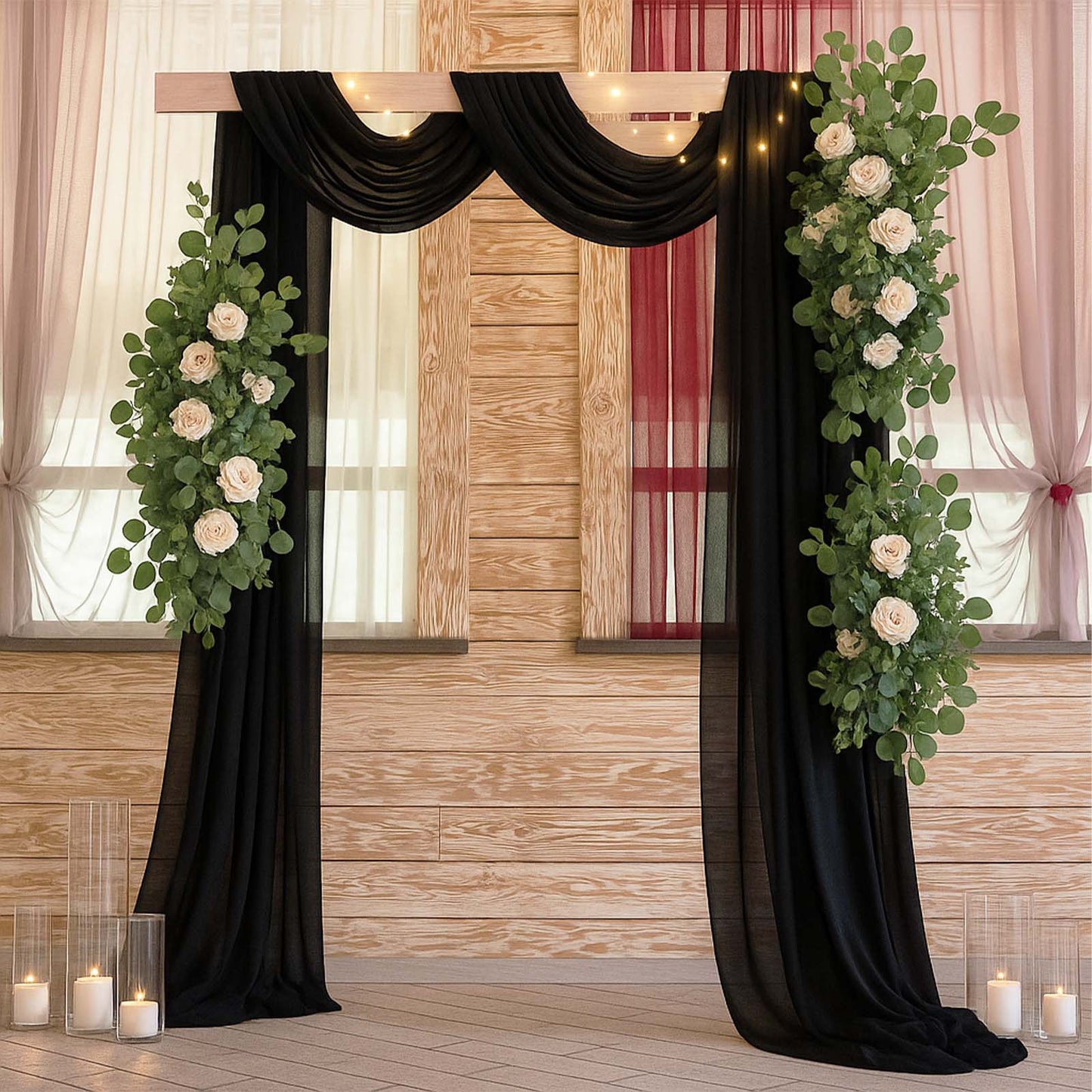 Black sheer backdrop drape with soft shimmer for wedding arch decor.