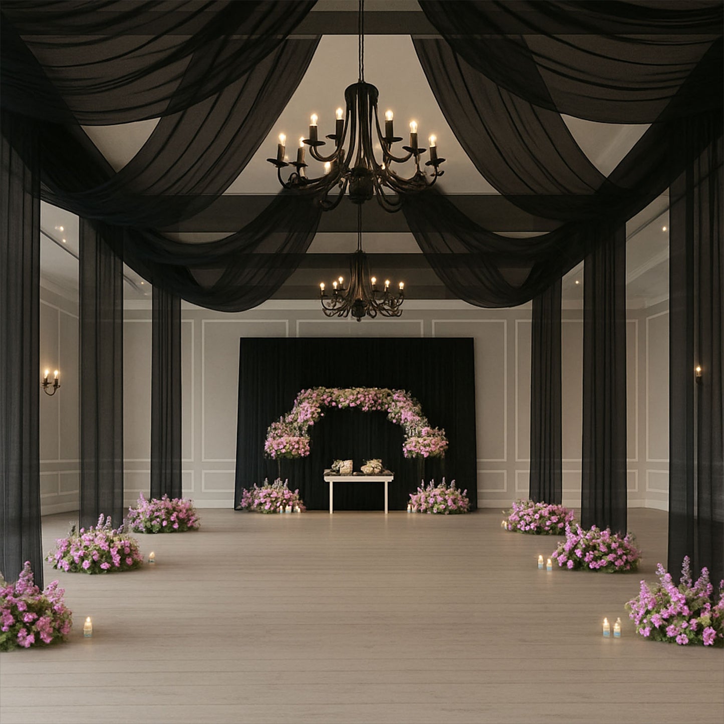 Black sheer backdrop drape for wedding arch and ceiling decor.
