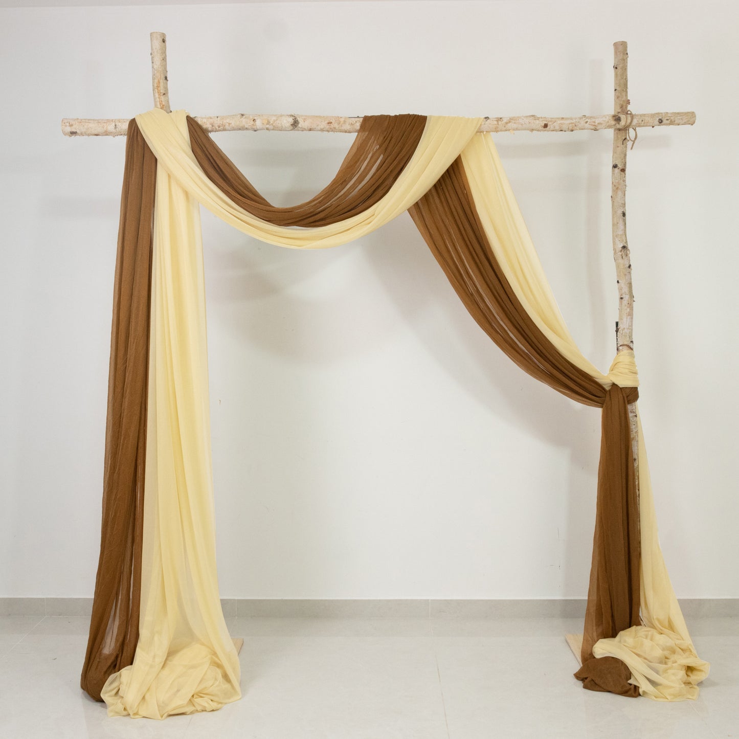 Champagne sheer backdrop drape for wedding arch and ceiling decor.