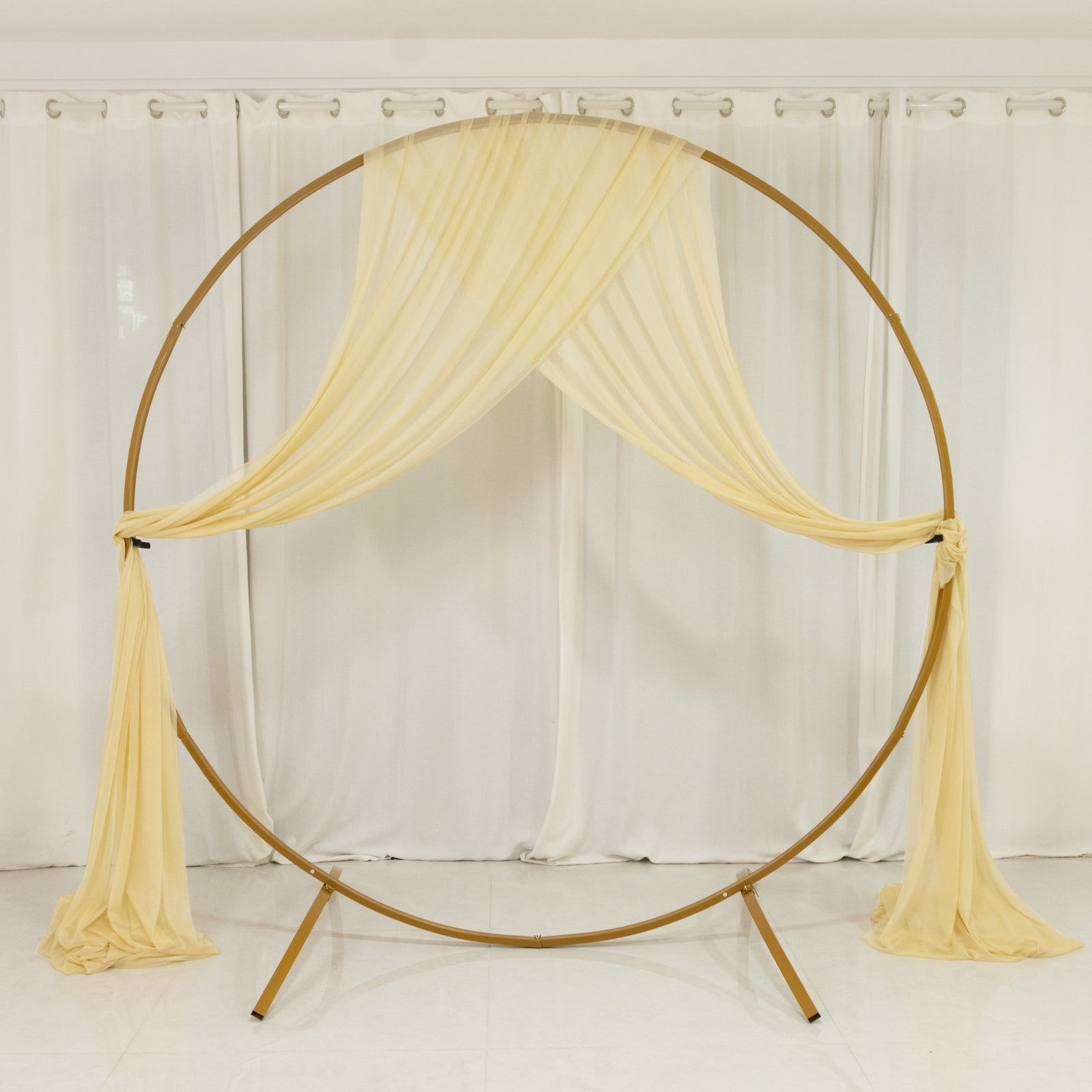Champagne sheer backdrop drape for wedding arch and ceiling decor.