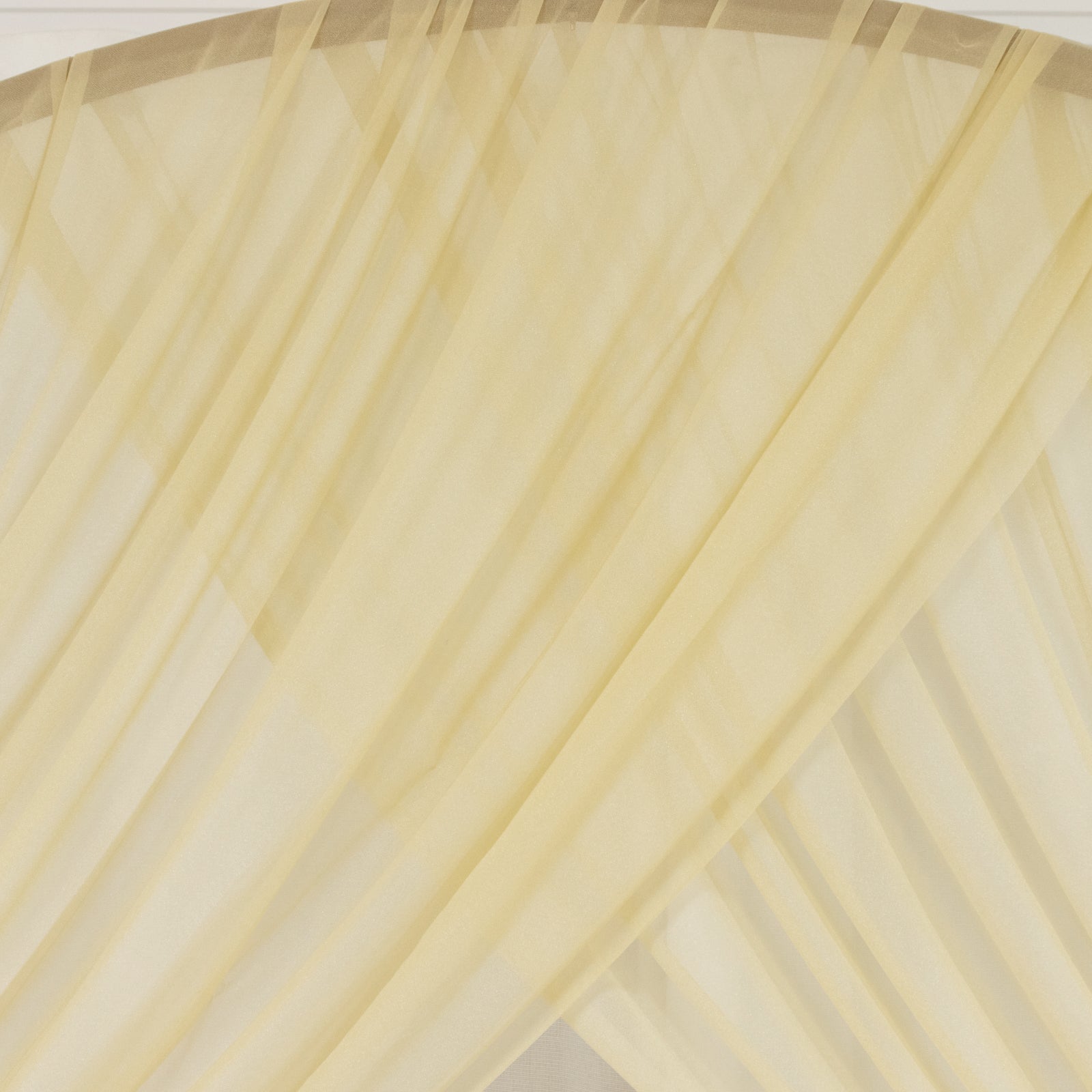 Champagne sheer backdrop drape for wedding arch and ceiling decor.
