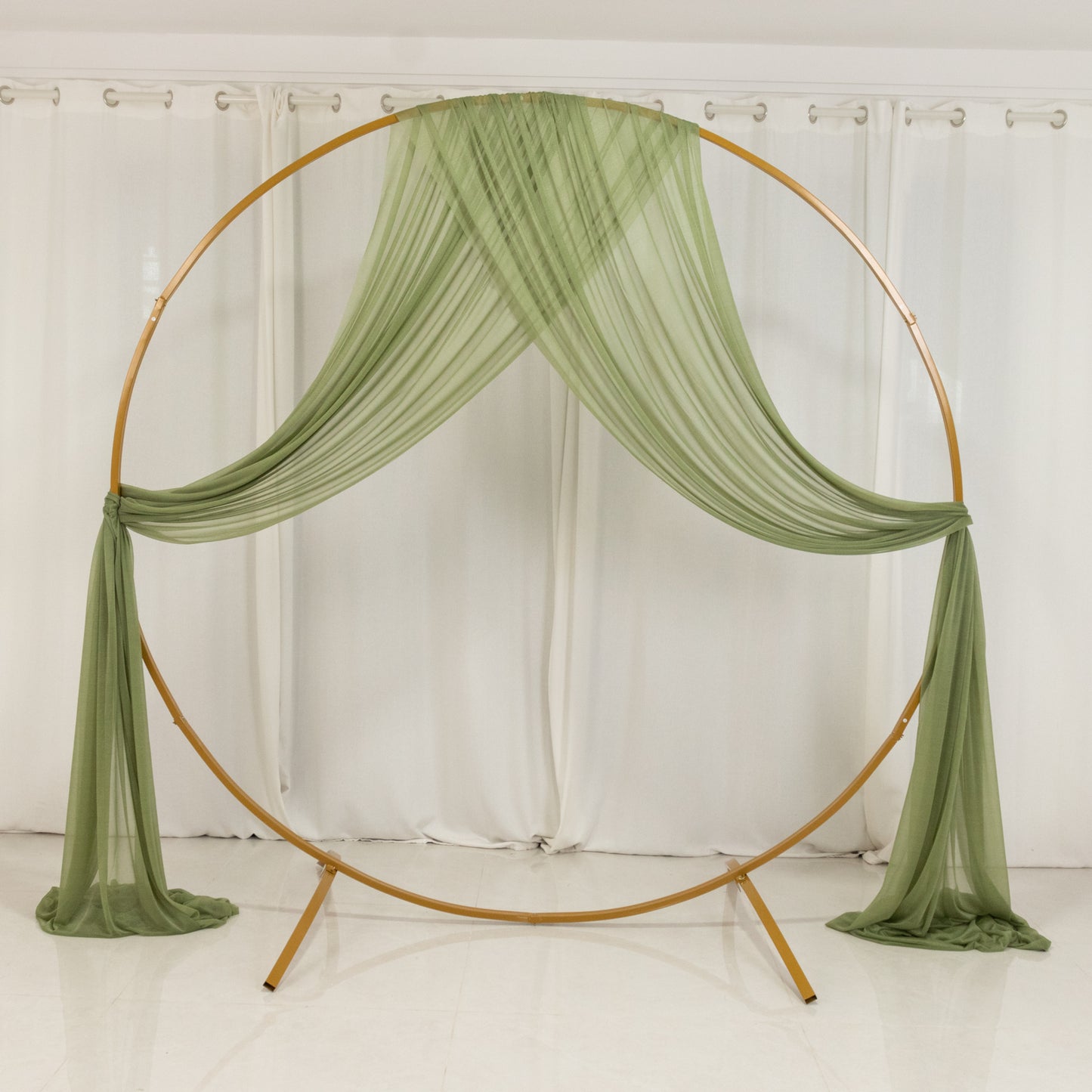 Dusty sage green sheer backdrop drape for wedding arch and ceiling decor.