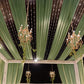Dusty sage green sheer backdrop drape with soft shimmer for wedding decor.
